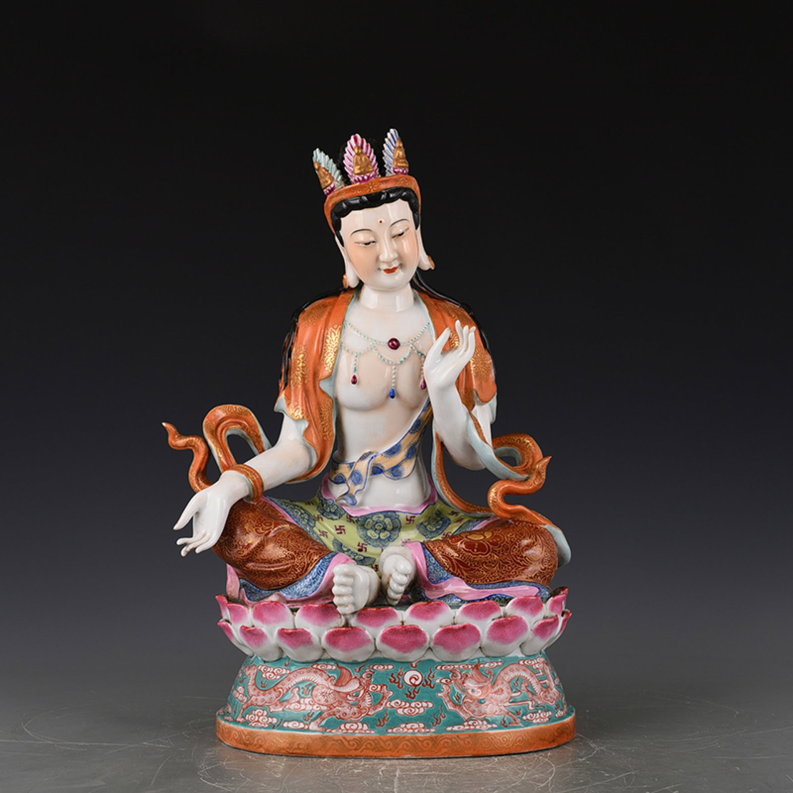 A Rare Famille-Rose Painted Gold Auspicious Cloud and Dragon Pattern Statue of Avalokitesvara: Estimated Value:4500-9000 A Rare Famille-Rose Painted Gold Auspicious Cloud and Dragon Pattern Statue of Avalokitesvara, Qing Dynasty, China,Qianlong Four-character Mark,Size:15.4inx9.4in
