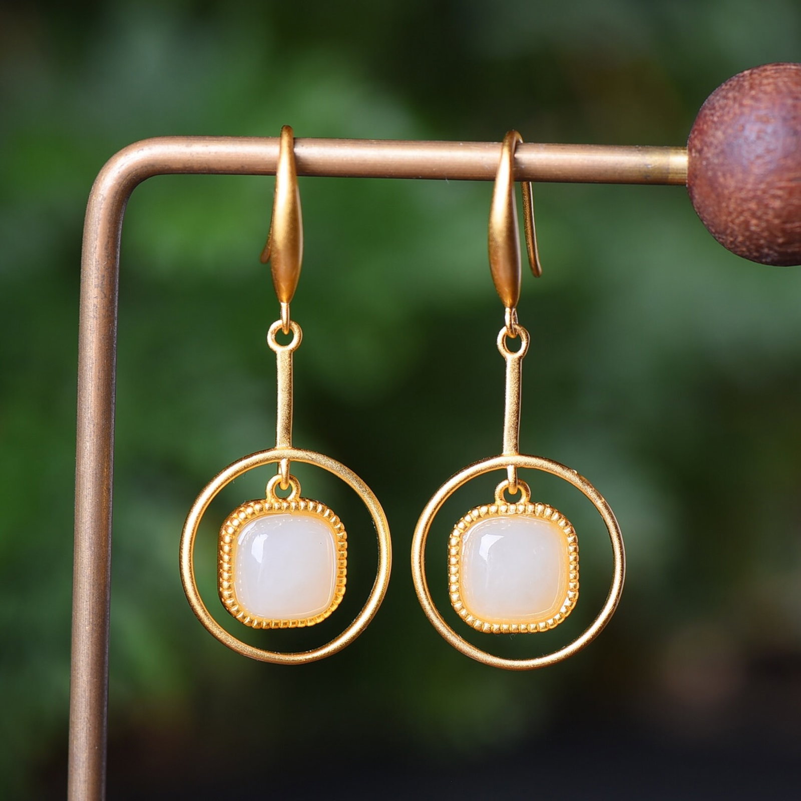 A Pair of Exquisite Sterling Silver-Gold Plated Inlaid White Jade Earrings: Estimated Value:200-400 A Pair of Exquisite Sterling Silver-Gold Plated Inlaid White Jade Earrings,Size:8mmx8mm 一对纯银镀金镶白玉耳环