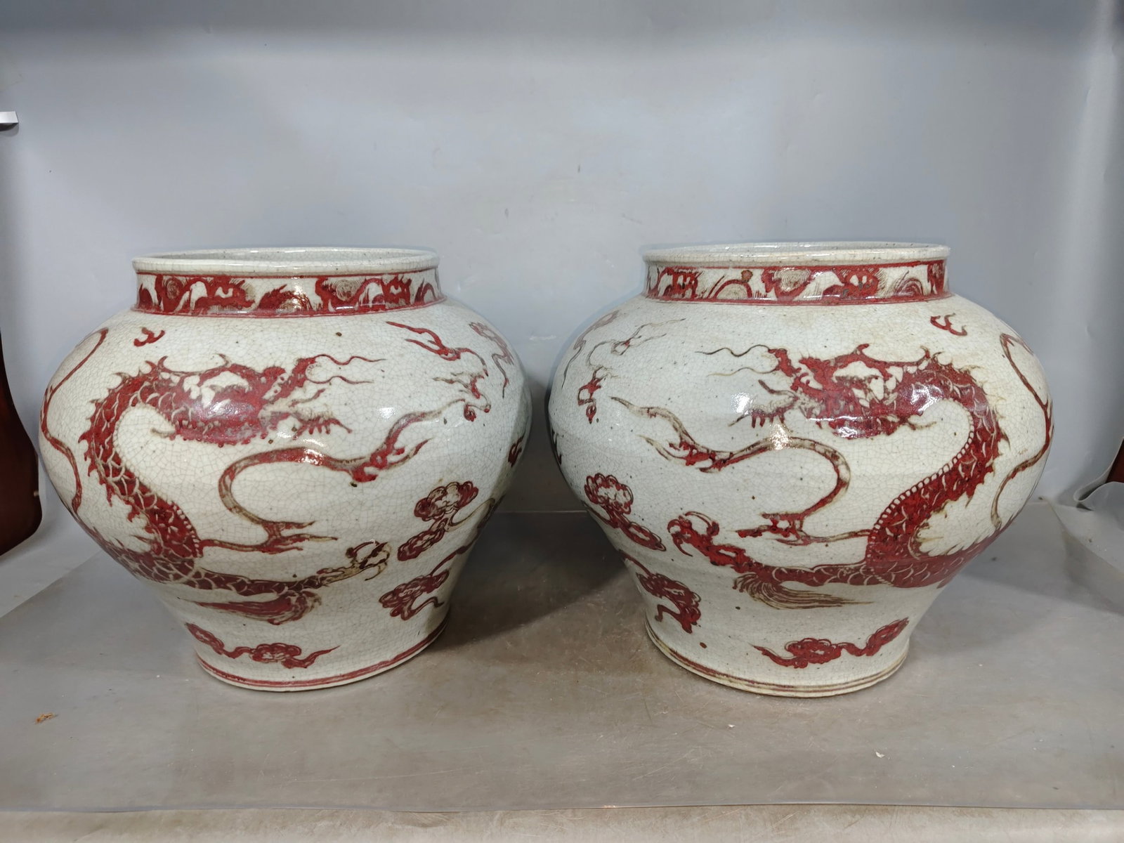 A Pair of Rare Underglaze-Red Auspicious Cloud and Dragon Pattern Jars: Estimated Value:3000-6000 A Pair of Rare Underglaze-Red Auspicious Cloud and Dragon Pattern Jars,Qing Dynasty,China,Size:12inx11.4in