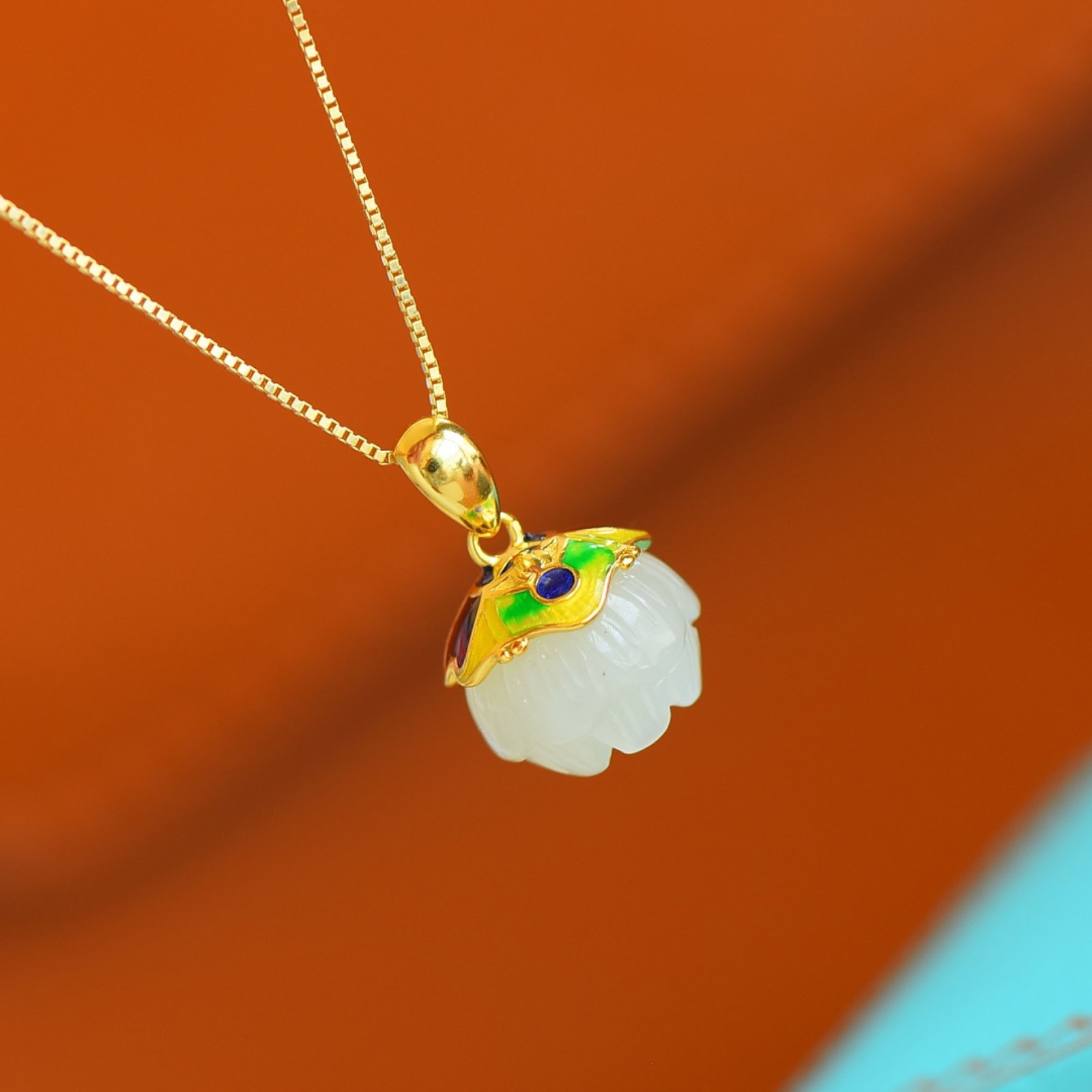 An Exquisite Sterling Silver-Gold Plated Inlaid White Jade Enamel Pendant: Estimated Value:200-400 An Exquisite Sterling Silver-Gold Plated Inlaid White Jade Enamel Pendant,Size:12mmx12mm 纯银镀金镶白玉珐琅吊坠