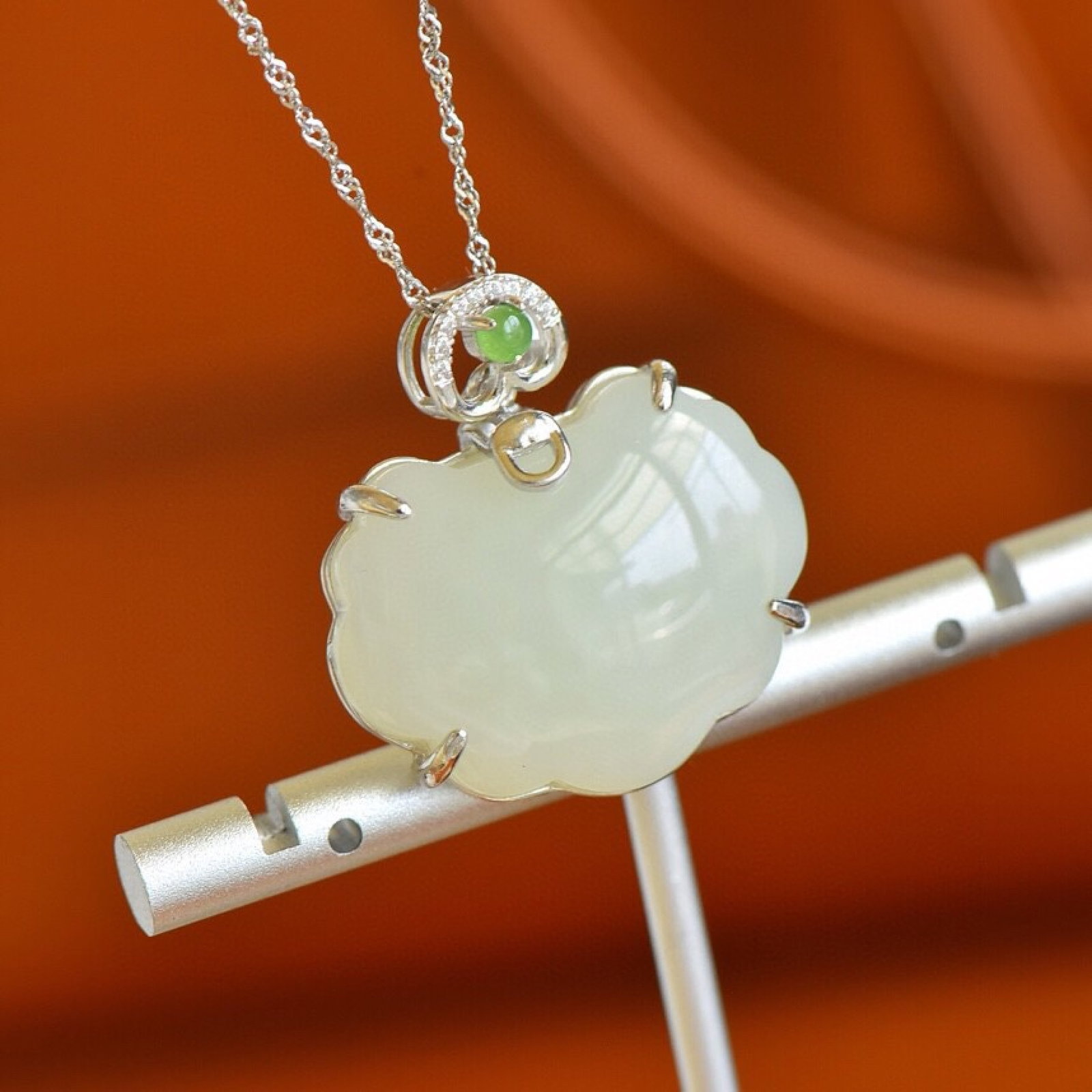 An Exquisite Sterling Silver Inlaid White Jade Pendant,Inlaid Jasper and Gems: Estimated Value:300-600 An Exquisite Sterling Silver Inlaid White Jade Pendant,Inlaid Jasper and Gems,Size:21mmx28mm