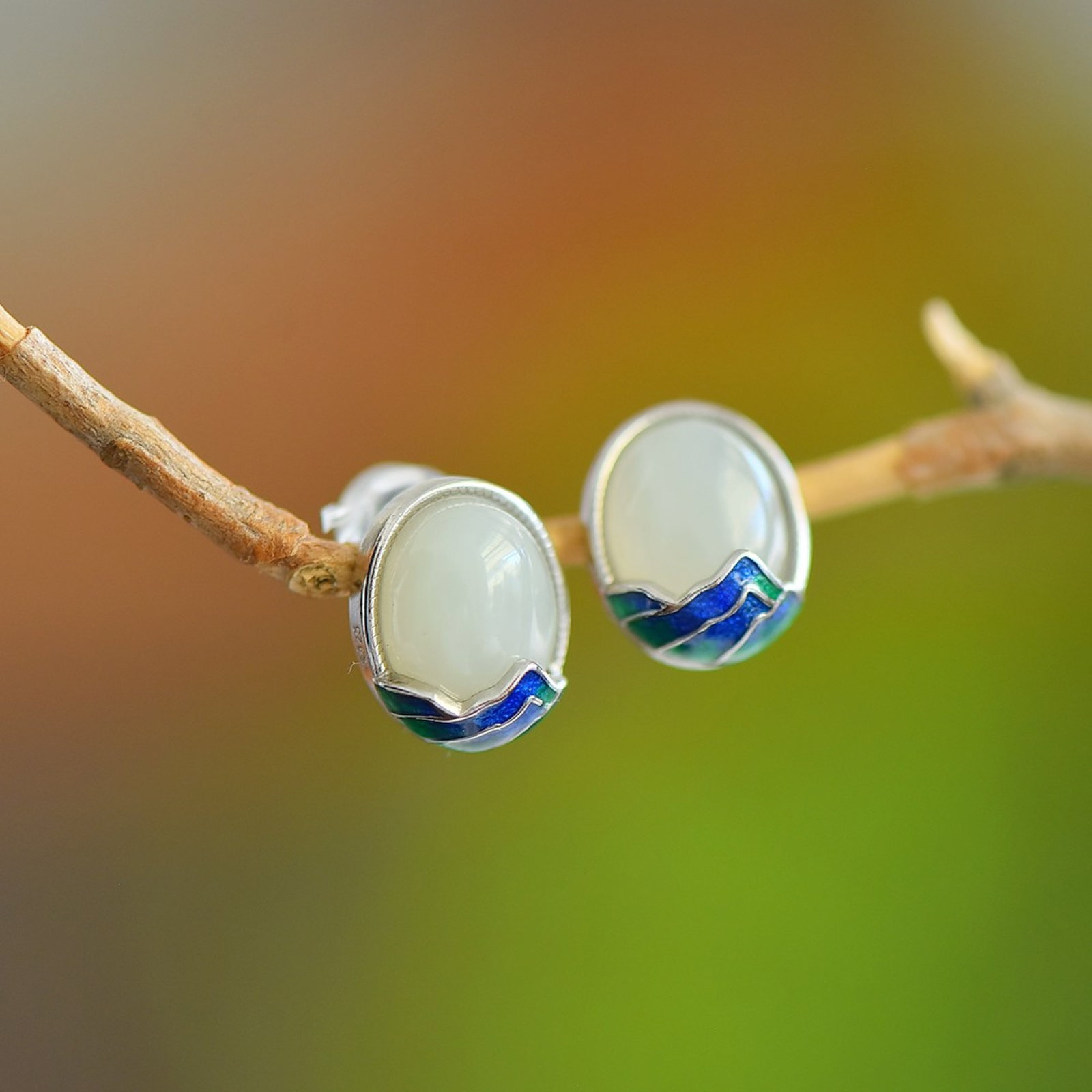A Pair of Exquisite Sterling Silver Inlaid White Jade Earrings: Estimated Value:200-400 A Pair of Exquisite Sterling Silver Inlaid White Jade Earring,Size:8mmx10mm 一对纯银镶白玉耳钉