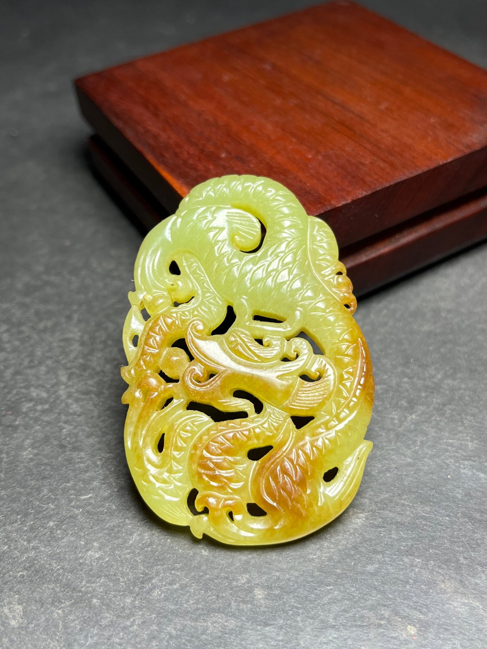 An Exquisite Yellow Jade Dragon Pendant: Estimated Value:920-1900 An Exquisite Yellow Jade Dragon Pendant,Qing Dynasty,China,Size:41mmx9mmx61mm,Weight:34g 黄玉龙挂件,中国清代