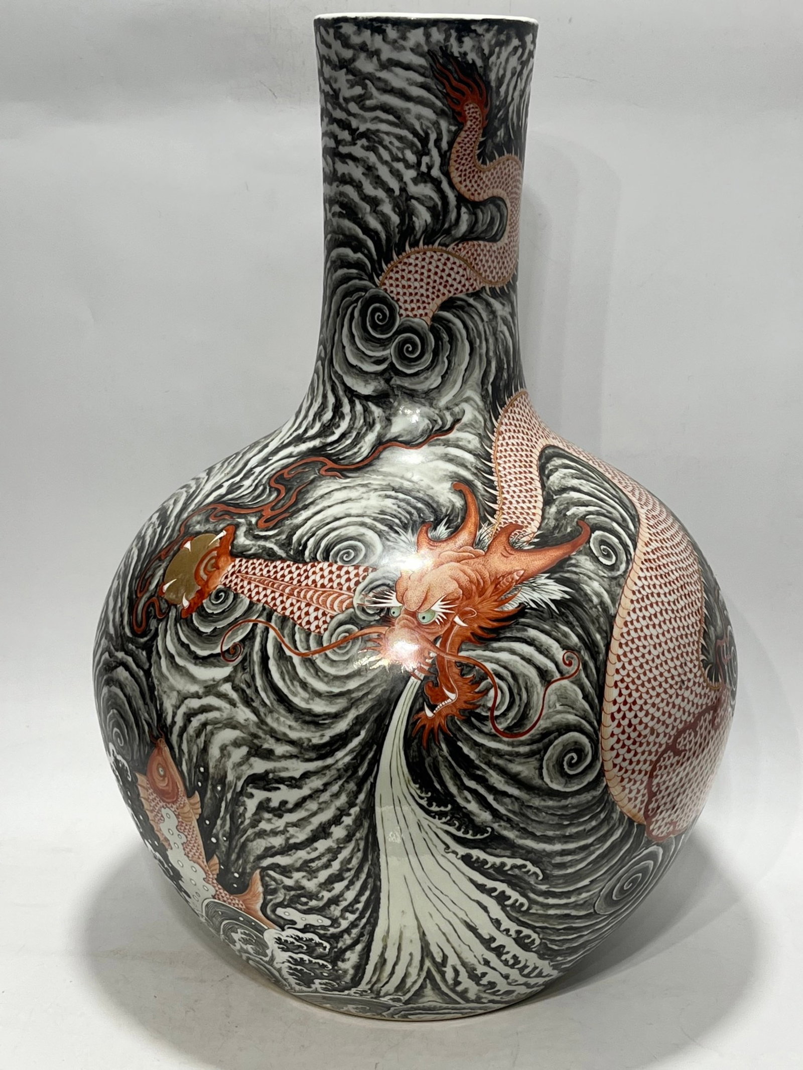 An Exquisite Famille-Rose Seawater and Dragon Pattern Vase: Estimated Value:5600-11200 An Exquisite Famille-Rose Seawater and Dragon Pattern Vase,Qing Dynasty,China,Qianlong Six-character Mark,Size:23.1in