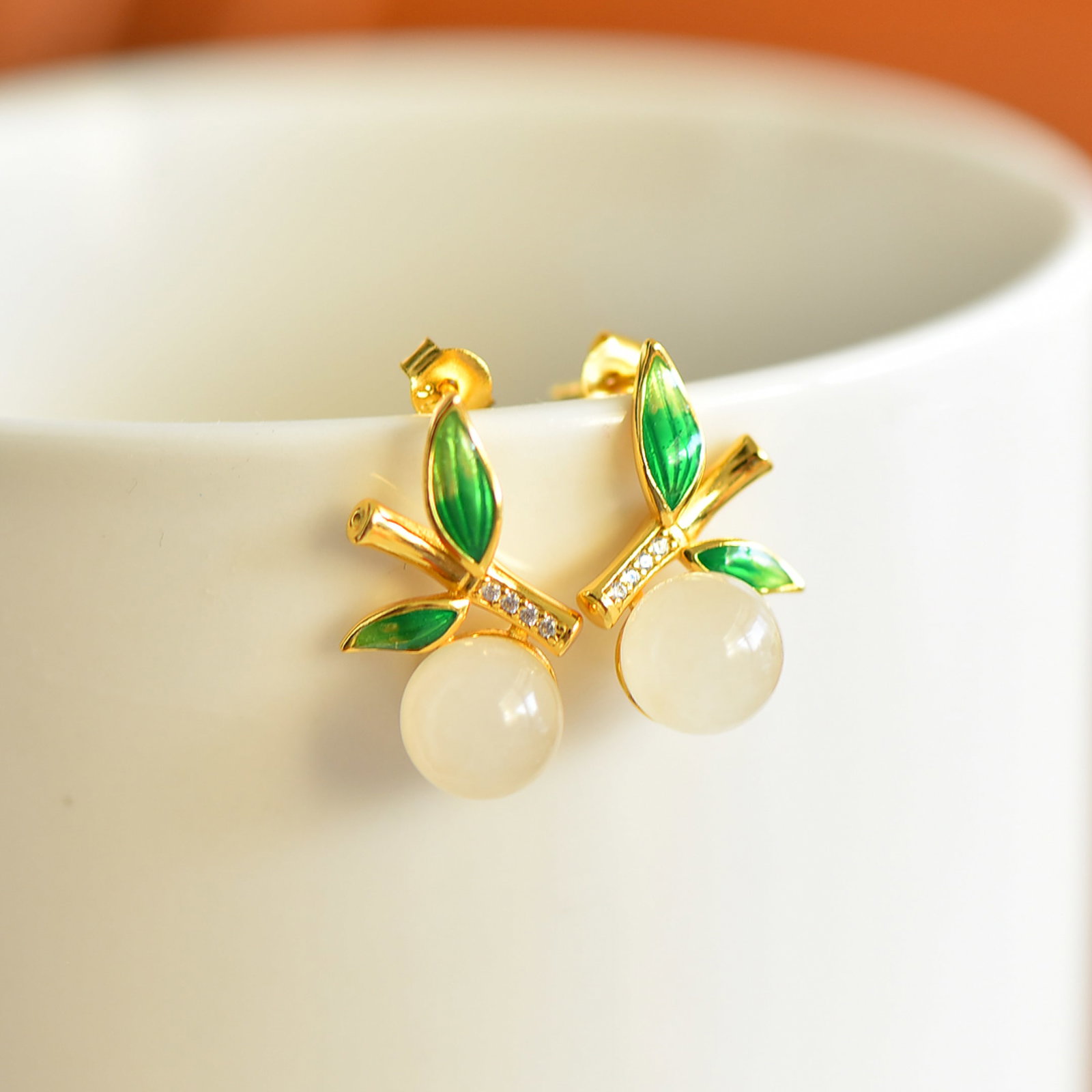 A Pair of Exquisite Sterling Silver-Gold Plated Inlaid White Jade Enamel Earrings,Inlaid Diamonds: Estimated Value:200-400 A Pair of Exquisite Sterling Silver-Gold Plated Inlaid White Jade Enamel Earrings,Inlaid Diamonds,Size:8mmx8mm