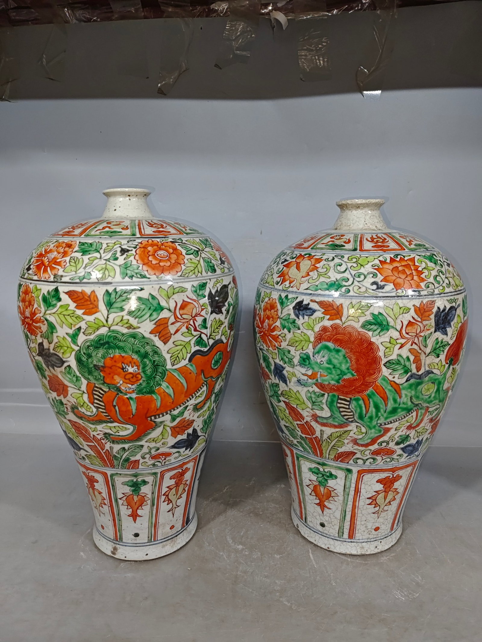 A Pair of Huge Blue and White Wucai Lotus and Lion Pattern Vases: Estimated Value:3600-7200 A Pair of Huge Blue and White Wucai Lotus and Lion Pattern Vases,Qing Dynasty,China,Size:7.5inx16.5in