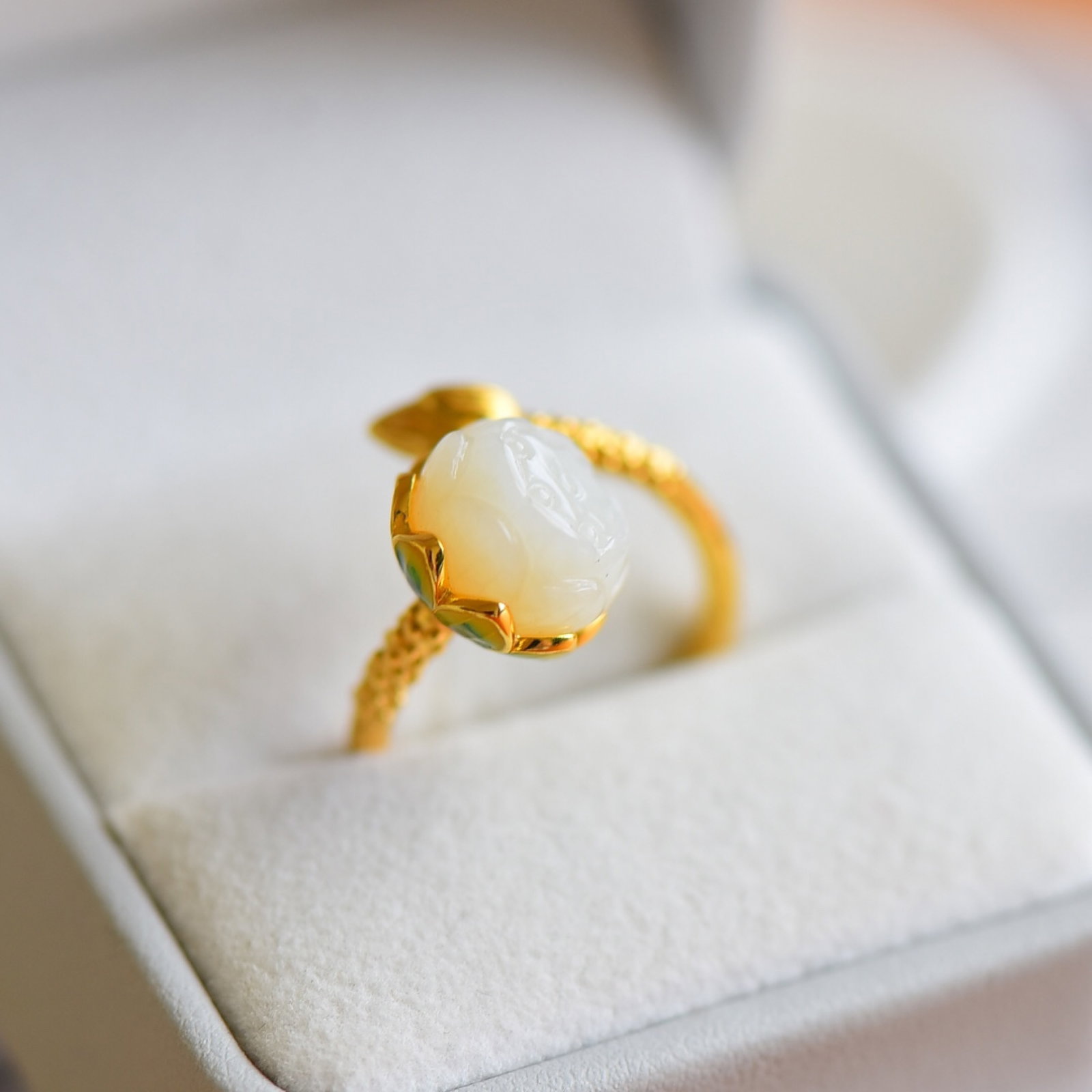 An Exquisite Sterling Silver-Gold Plated Inlaid White Jade Enamel Ring: Estimated Value:400-800 An Exquisite Sterling Silver-Gold Plated Inlaid White Jade Enamel Ring,Size:11mmx11mm 纯银镀金镶白玉珐琅戒指
