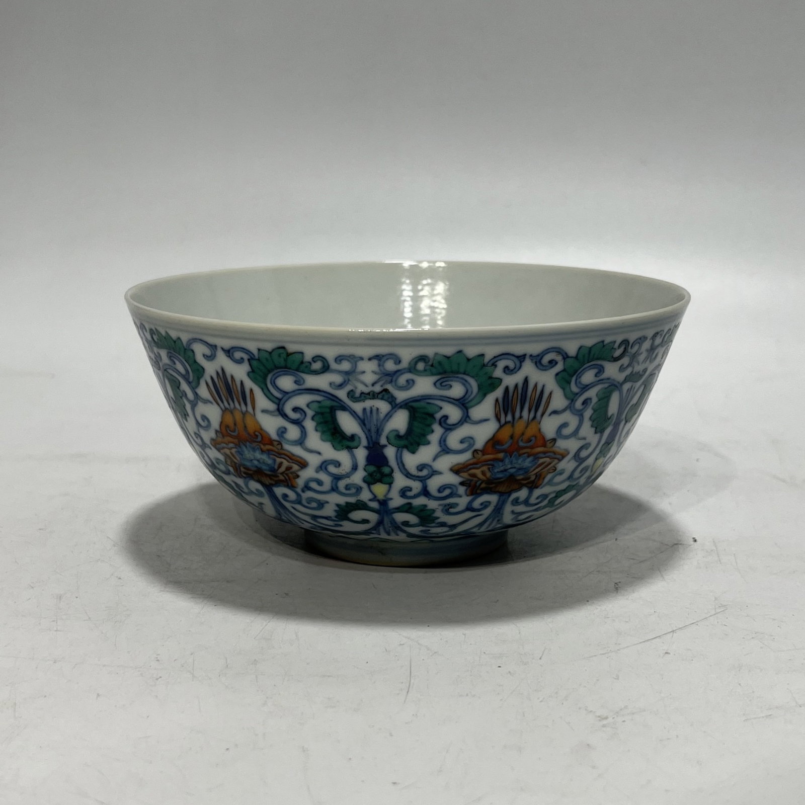 An Exquisite Doucai Lotus Pattern Bowl: Estimated Value:1400-2800 An Exquisite Doucai Lotus Pattern Bowl,Qing Dynasty,China,Guangxu Six-character Mark,Size:5.8in