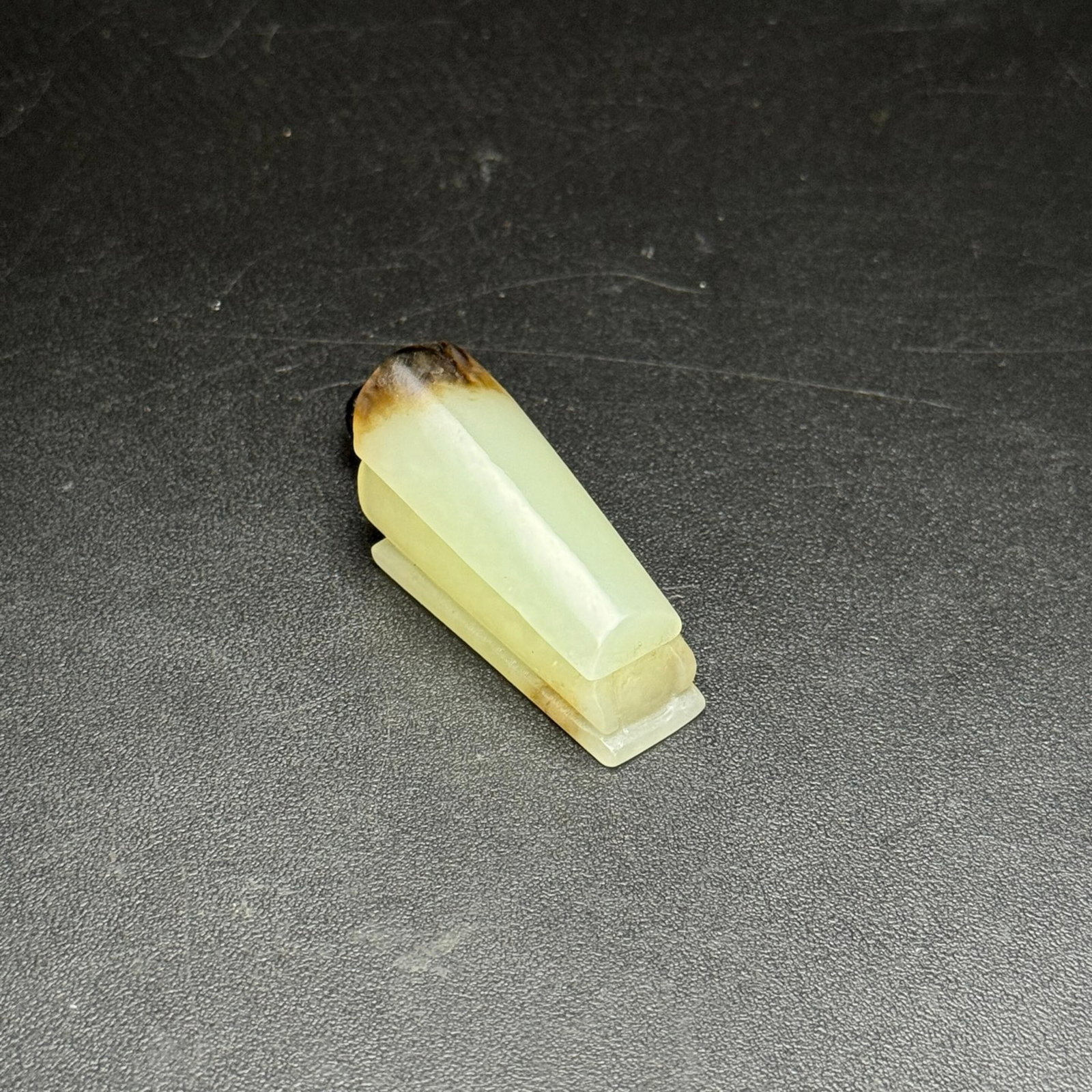 An Exquisite White Jade Coffin-Shaped Pendant: Estimated Value:720-1500 An Exquisite White Jade Coffin-Shaped Pendant,Qing Dynasty,China,Size:18mmx16mmx36mm,Weight:17g
