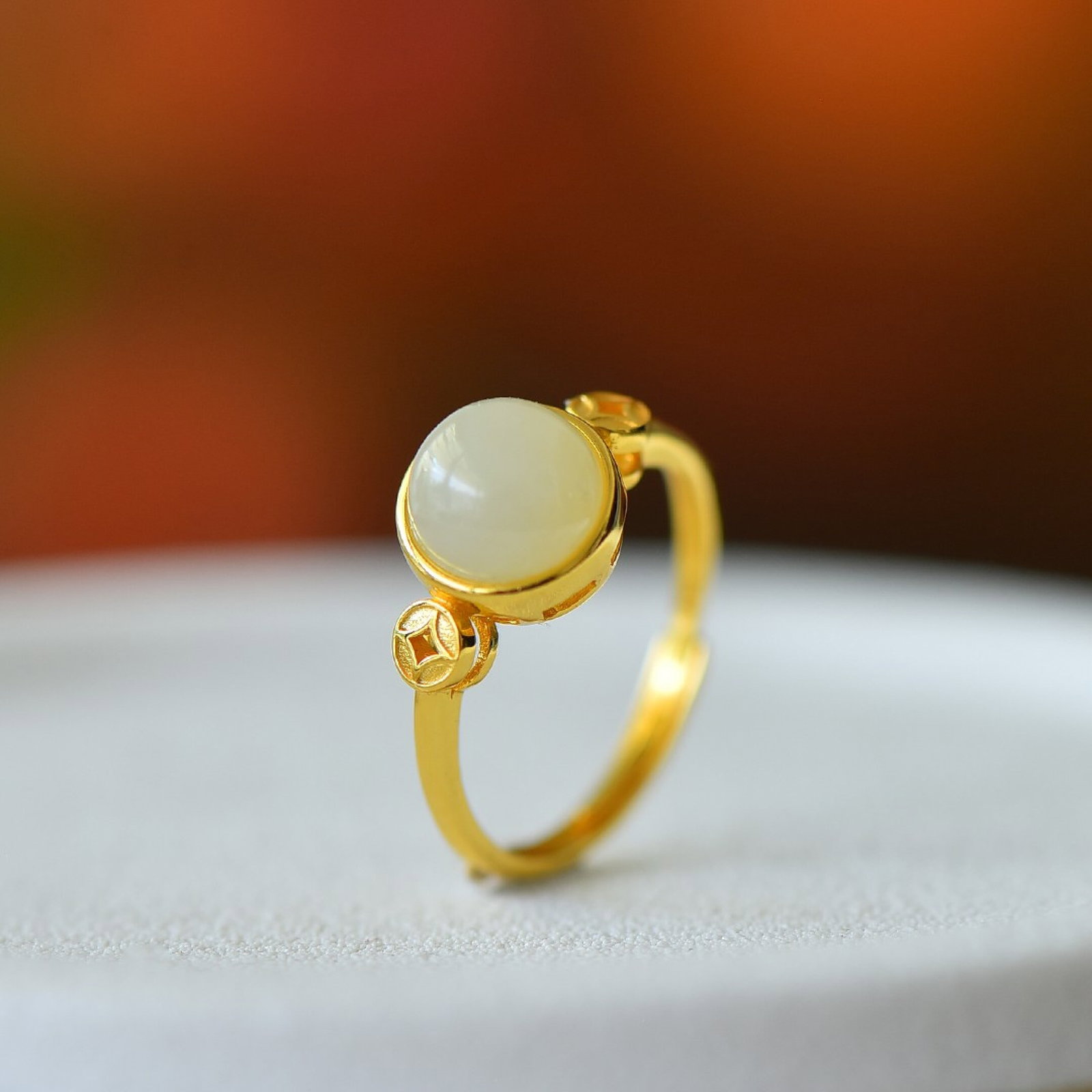 An Exquisite Sterling Silver-Gold Plated Inlaid White Jade Ring: Estimated Value:200-400 An Exquisite Sterling Silver-Gold Plated Inlaid White Jade Ring,Size:8mmx8mm 纯银镀金镶白玉戒指