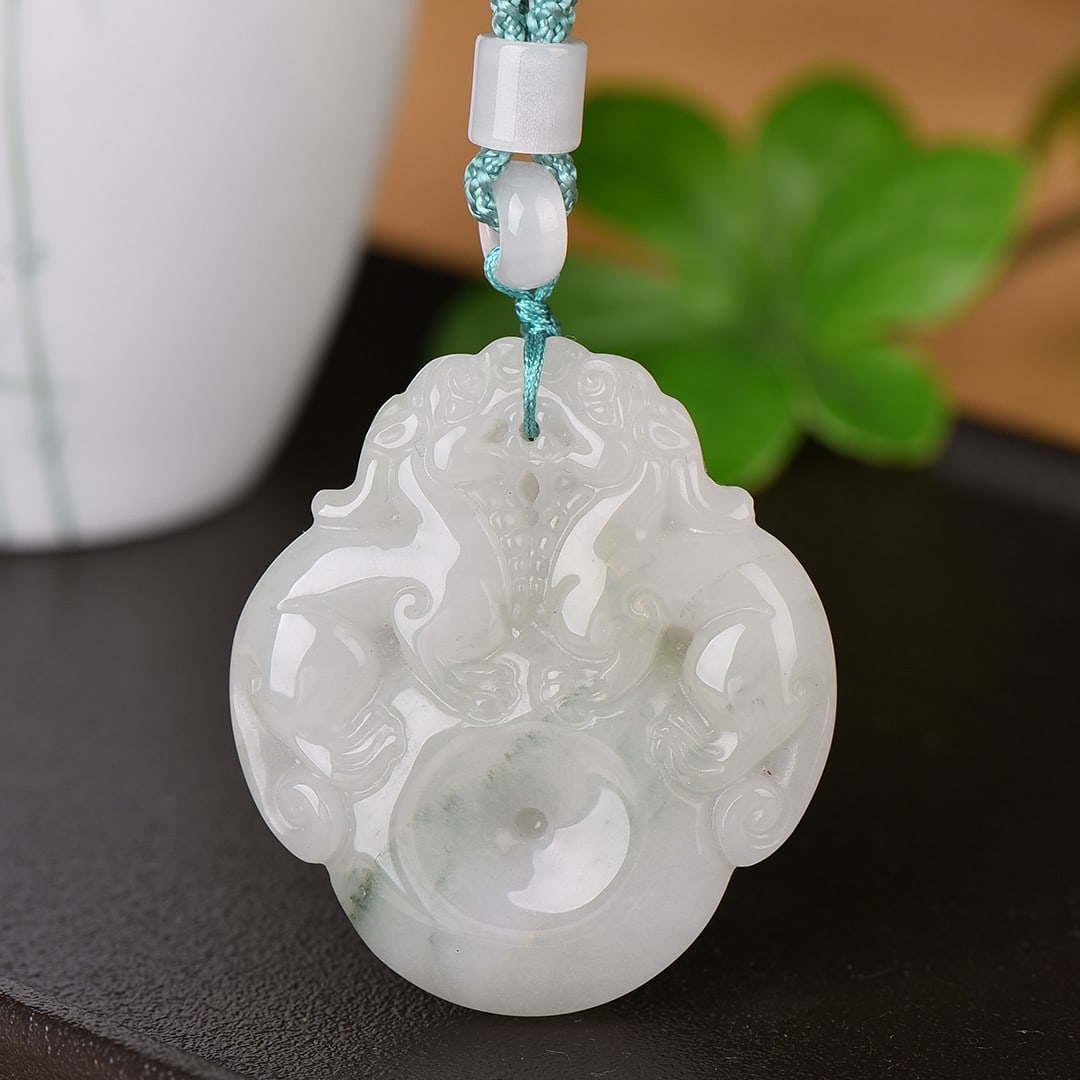 An Exquisite White Jade Auspicious Beast Pendant: Estimated Value:200-400 An Exquisite White Jade Auspicious Beast Pendant,Size:44mmx49mm 寓意:招财进宝 白玉貔貅挂件
