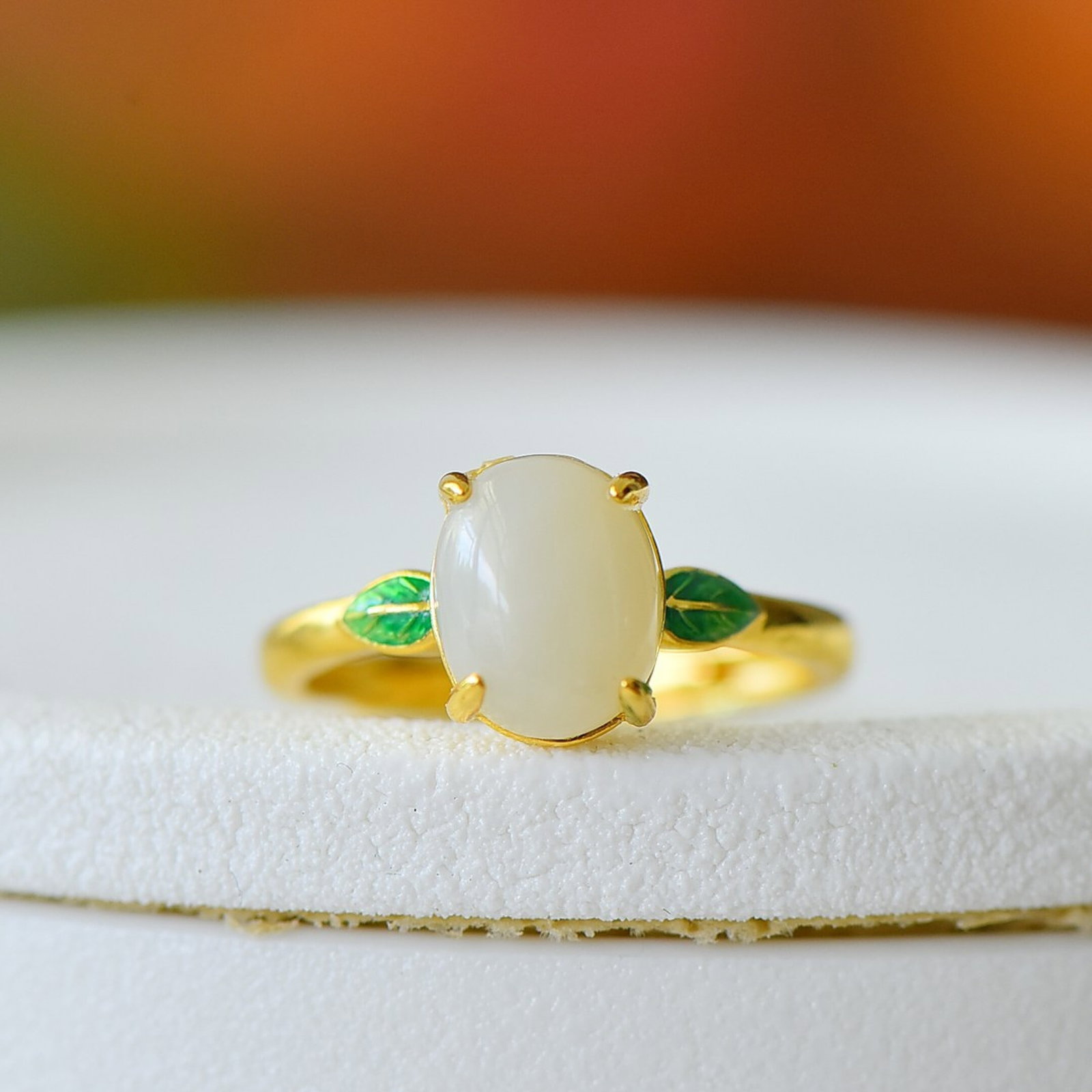An Exquisite Sterling Silver-Gold Plated Inlaid White Jade Ring: Estimated Value:200-400 An Exquisite Sterling Silver-Gold Plated Inlaid White Jade Ring,Size:8mmx10mm 纯银镀金镶白玉戒指