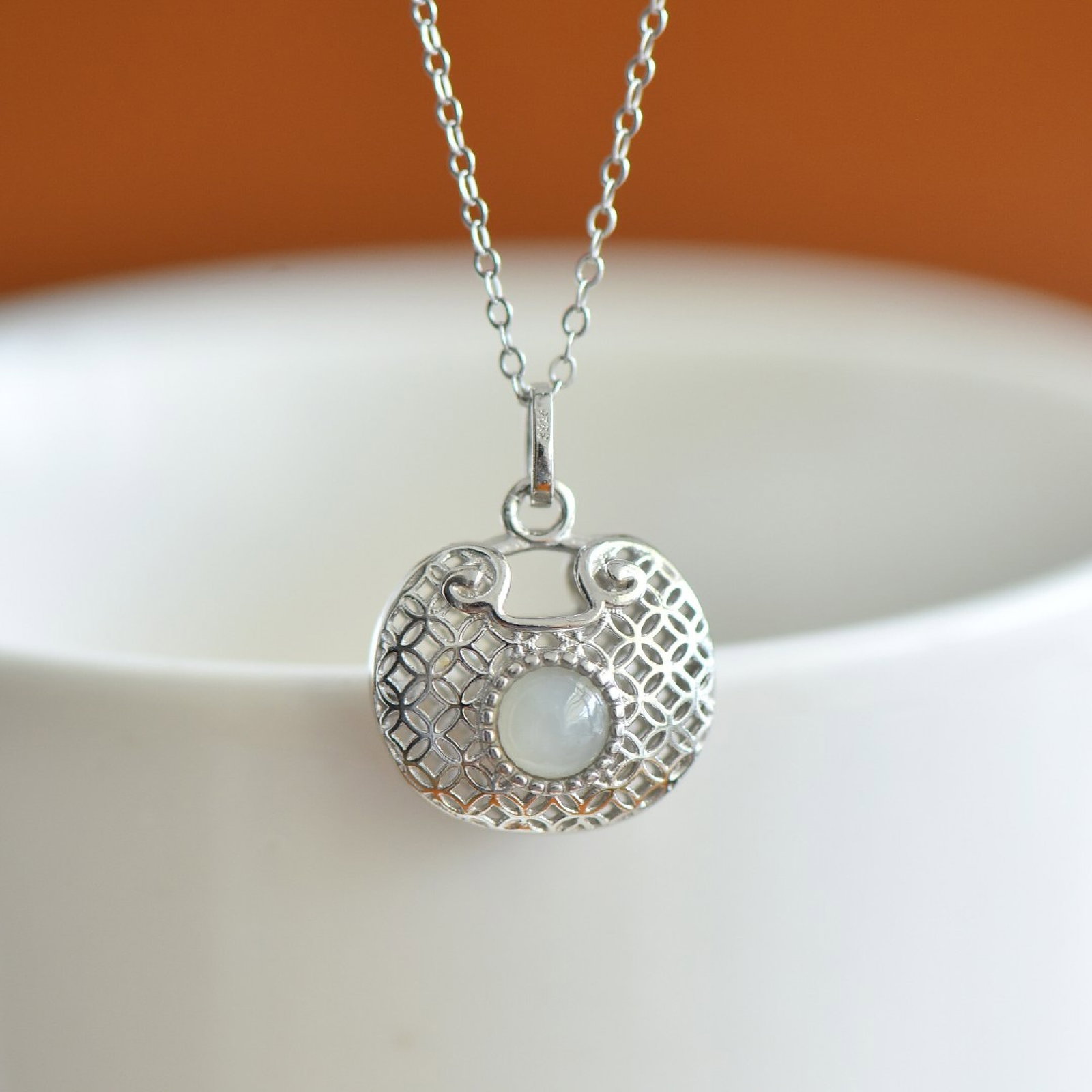 An Exquisite Sterling Silver Inlaid White Jade Pendant: Estimated Value:200-400 An Exquisite Sterling Silver Inlaid White Jade Pendant,Size:5mmx5mm 纯银镶白玉吊坠