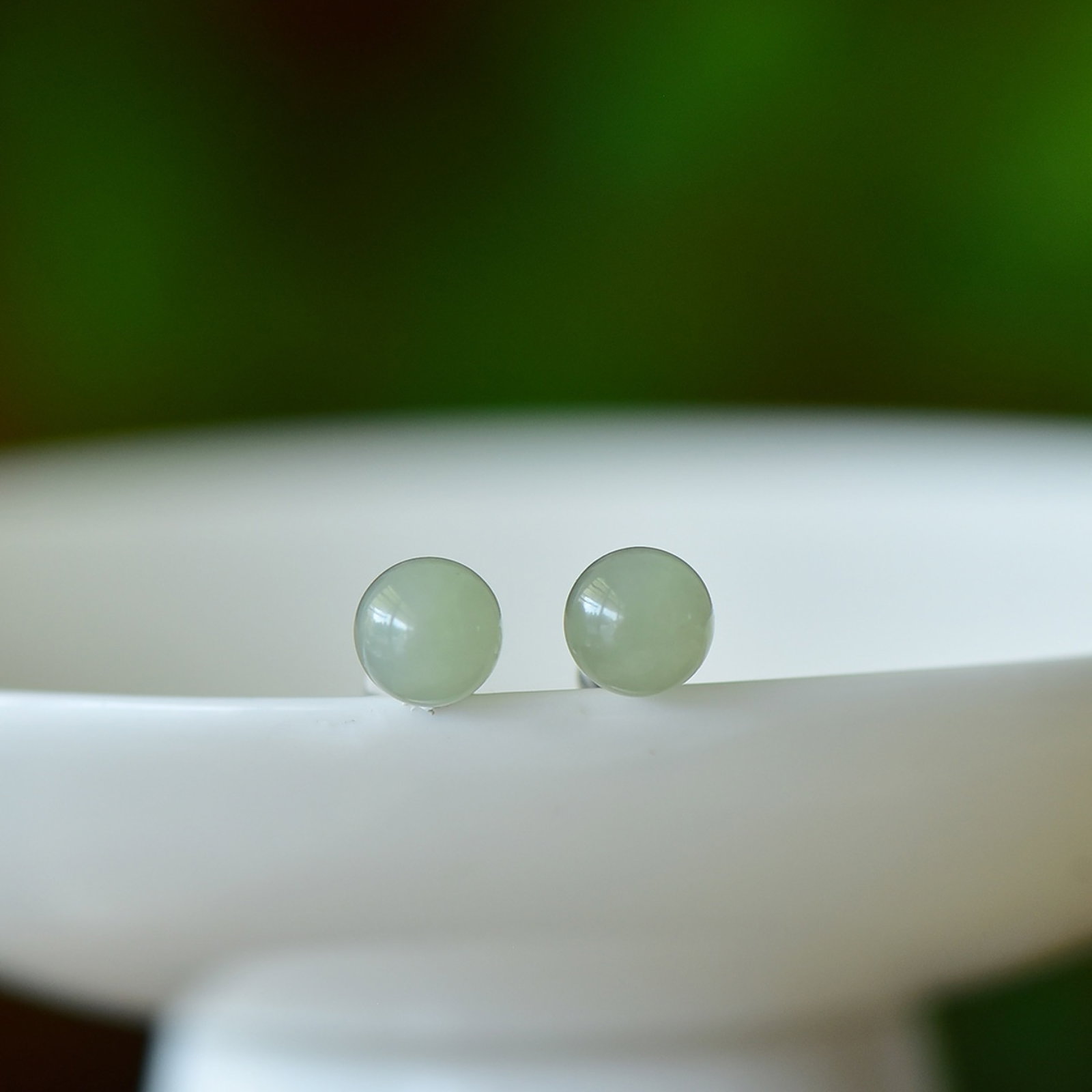 A Pair of Exquisite Sterling Silver Inlaid Greenish Jade Earrings: Estimated Value:200-400 A Pair of Exquisite Sterling Silver Inlaid Greenish Jade Earrings,Size:8mmx8mm 一对纯银镶青白玉耳钉