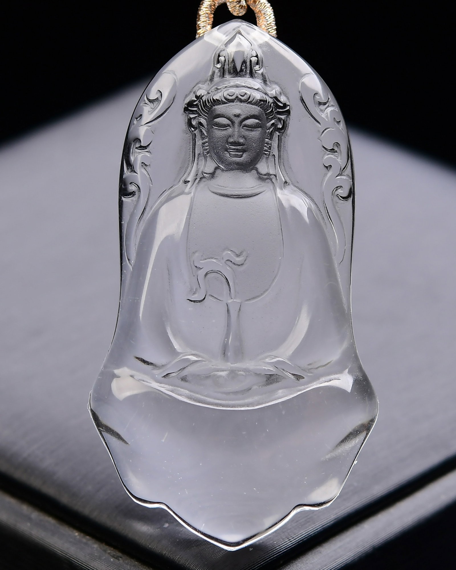 An Exquisite Crystal Statue of Avalokitesvara Pattern Pendant: Estimated Value:800-1600 An Exquisite Crystal Statue of Avalokitesvara Pattern Pendant,Size:55mmx30mmx12mm,Weight:36.5g