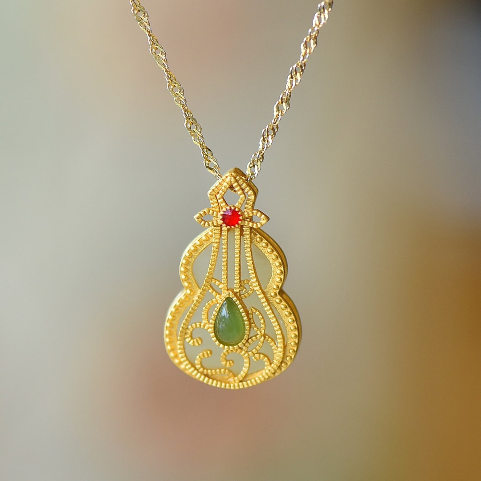 An Exquisite Sterling Silver-Gold Plated Inlaid White Jade Pendant: Estimated Value:200-400 An Exquisite Sterling Silver-Gold Plated Inlaid White Jade Pendant 纯银镀金镶白玉吊坠