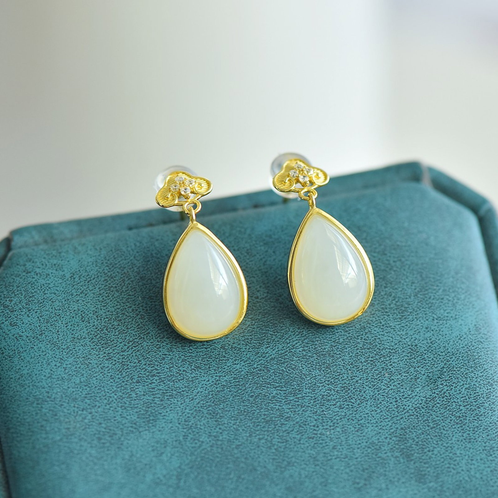 A Pair of Exquisite Sterling Silver-Gold Plated Inlaid White Jade Earrings,Inlaid Diamonds: Estimated Value:200-400 A Pair of Exquisite Sterling Silver-Gold Plated Inlaid White Jade Earrings,Inlaid Diamonds,Size:9mmx13mm