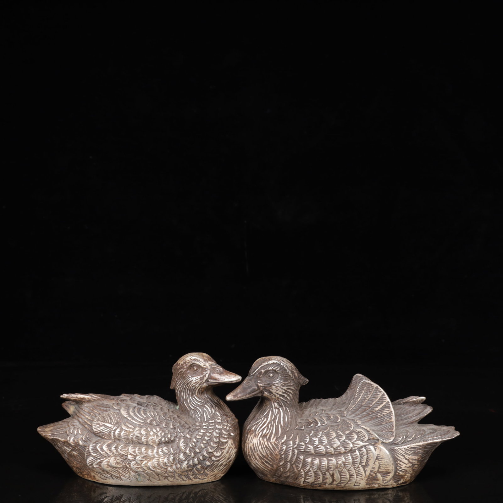 A Pair of Exquisite Silver-Plated Bronze Mandarin Duck Ornaments: A Pair of Exquisite Silver-Plated Bronze Mandarin Duck Ornaments,Qing Dynasty,China,Qianlong Four-character Mark,Size:5.5inx2.4inx3.5in,Weight:1300g