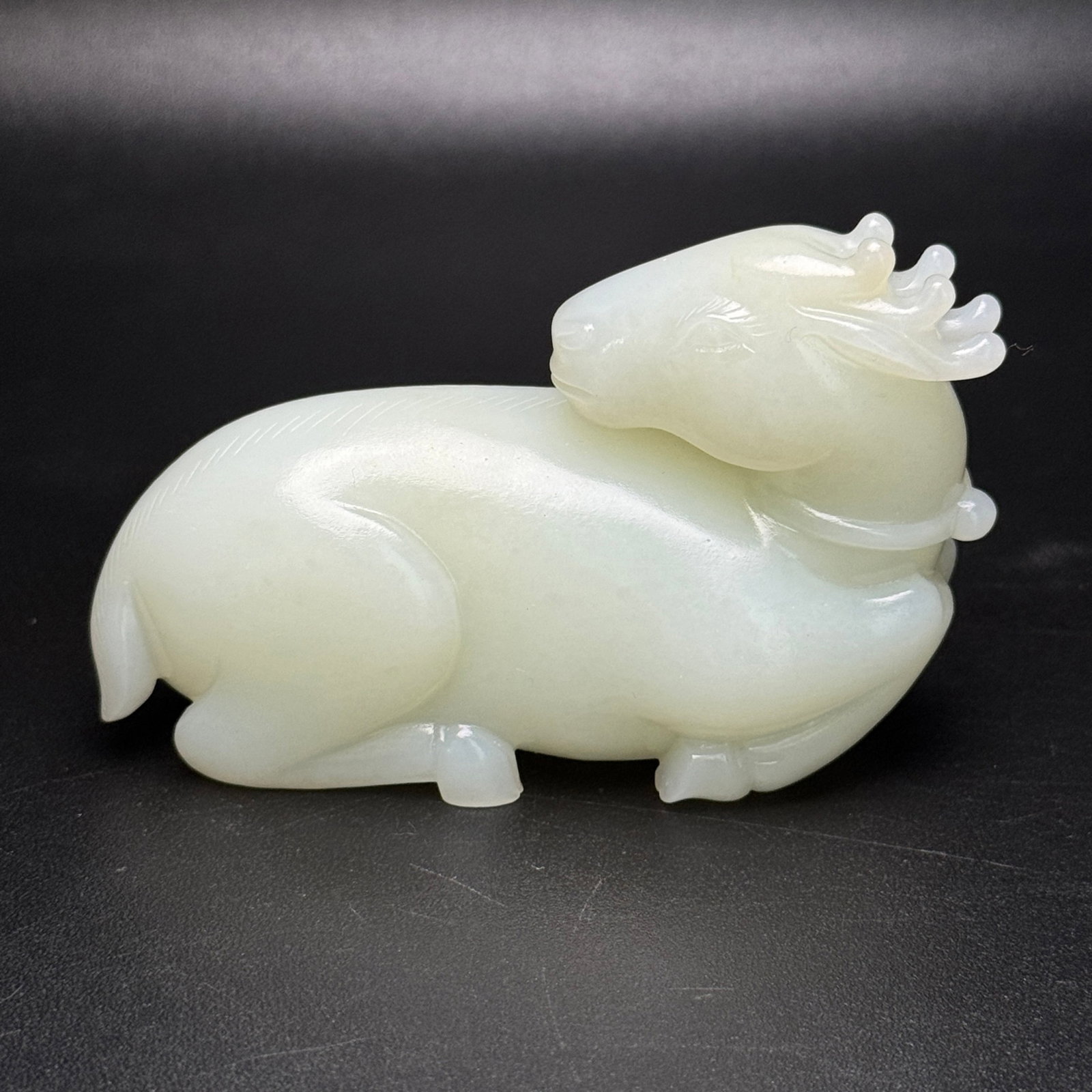 An Exquisite White Jade Deer Ornament: An Exquisite White Jade Deer Ornament,Qing Dynasty,China,Size:3.7inx2.2inx1.3in,Weight:211g 白玉鹿摆件,中国清代