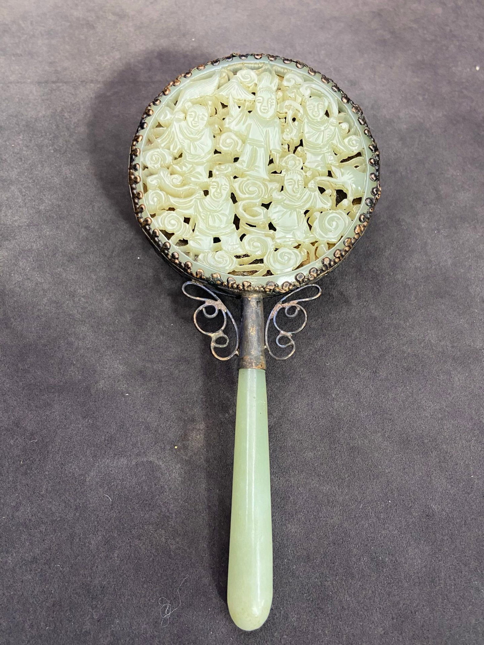 An Exquisite Silver Inlaid White Jade Hollow Auspicious Cloud and Figure Pattern Hand Mirror: An Exquisite Silver Inlaid White Jade Hollow Auspicious Cloud and Figure Pattern Hand Mirror,Qing Dynasty,China,Size:6.7inx3.3inx0.5in,Weight:137g 银镶白玉镂空Ķ