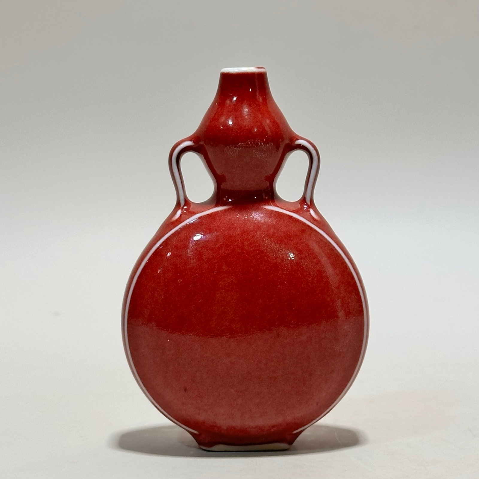 An Exquisite Red Glazed Double-Ears Gourd-Shaped Vase: An Exquisite Red Glazed Double-Ears Gourd-Shaped Vase,Qing Dynasty,China,Size:5.7inx3.1in 红釉双耳葫芦瓶,中国清代