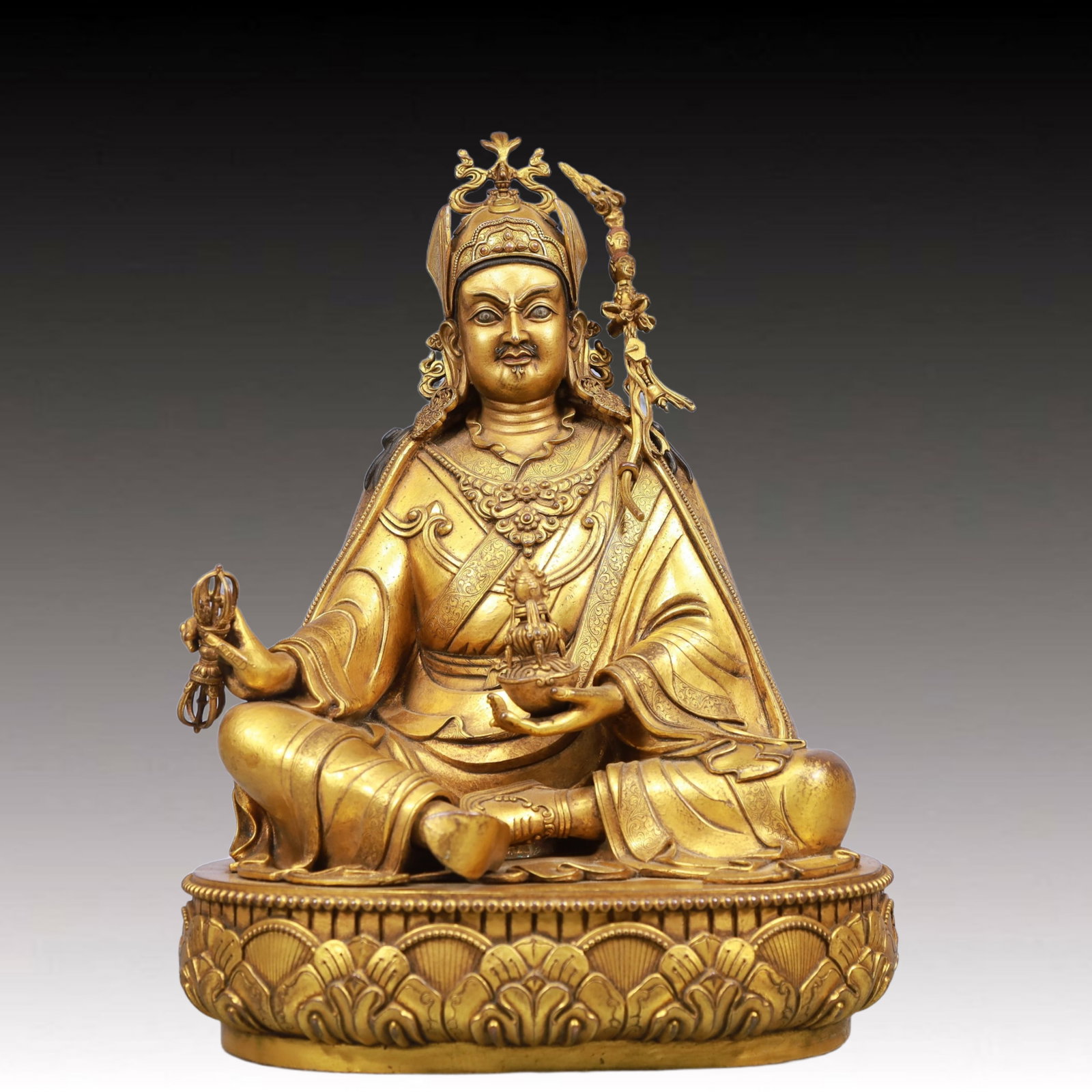 A Solemn Gilt BronzeStatue of Padma Sambhava: A Solemn Gilt BronzeStatue of Padma Sambhava, Qing Dynasty, China, Qianlong Mark, Size:9.4inx7.5inx13in, Weight:7200g