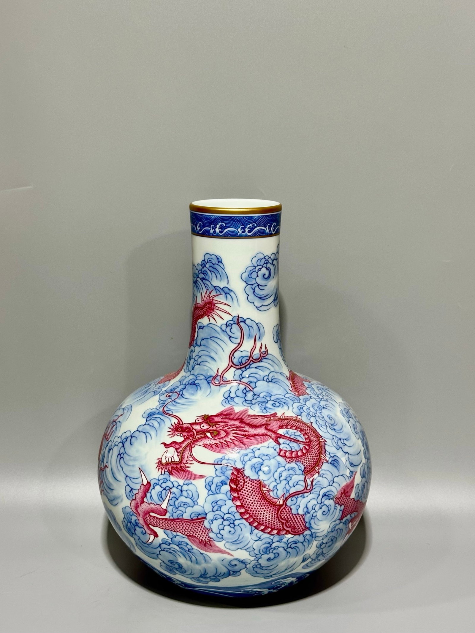 A Rare Blue and White Ruby Red-Glazed Auspicious Cloud and Dragon Pattern Vase: A Rare Blue and White Ruby Red-Glazed Auspicious Cloud and Dragon Pattern Vase,Qing Dynasty,China,Yongzheng Six-character Mark,Size:13.6inx10in 青花胭脂红祥云