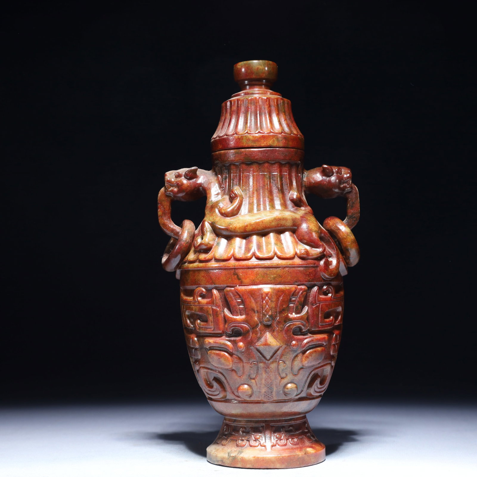 An Exquisite Archaic Jade Beast-Face Pattern Double-Ears Bottle (1 of 10)