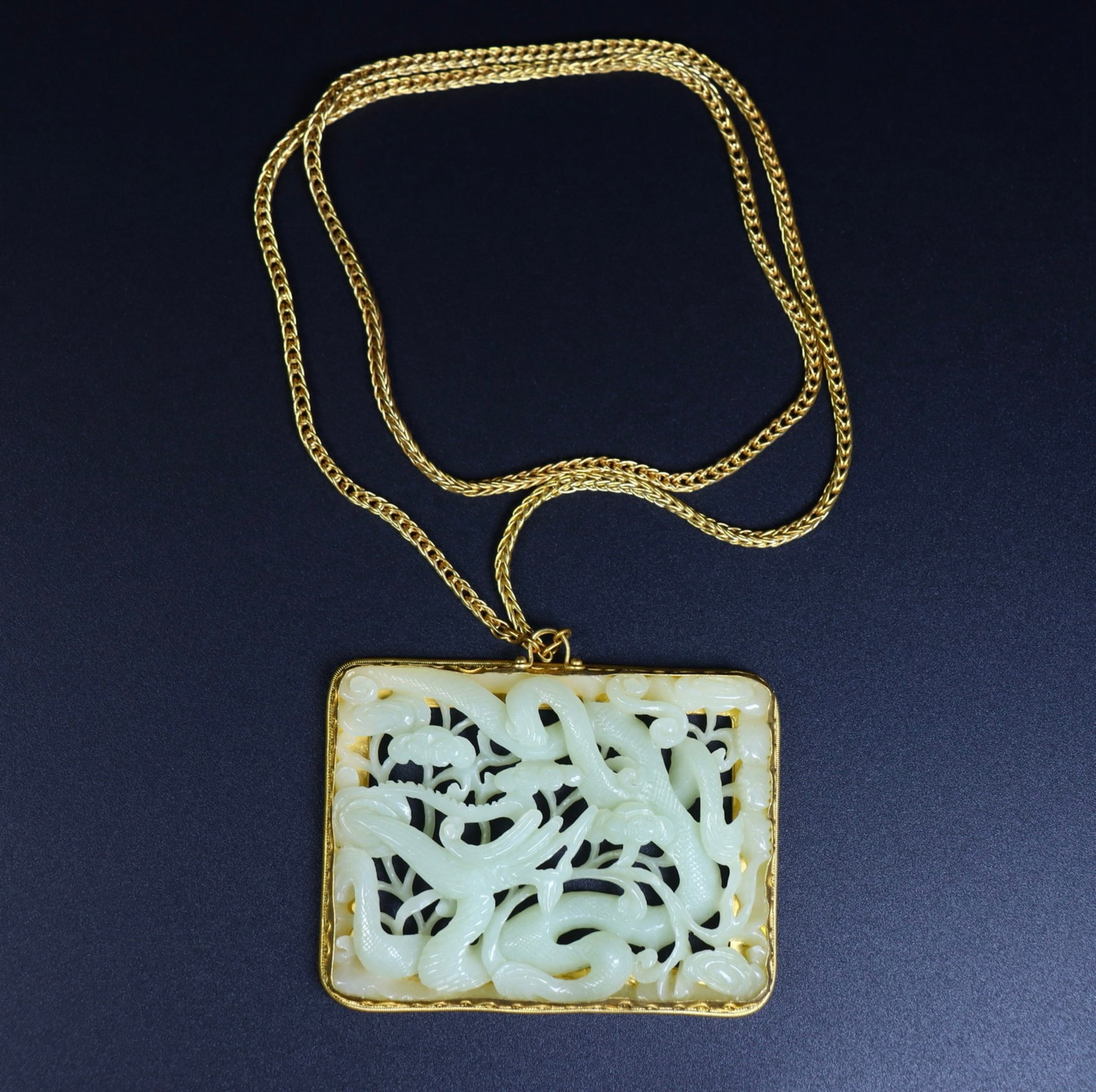 An Exquisite White Jade Inlaid Gilt Silver Dragon Pattern Pendant: An Exquisite White Jade Inlaid Gilt Silver Dragon Pattern Pendant,Qing Dynasty,China,Size:3.3inx2.8inx0.4in,Weight:111g