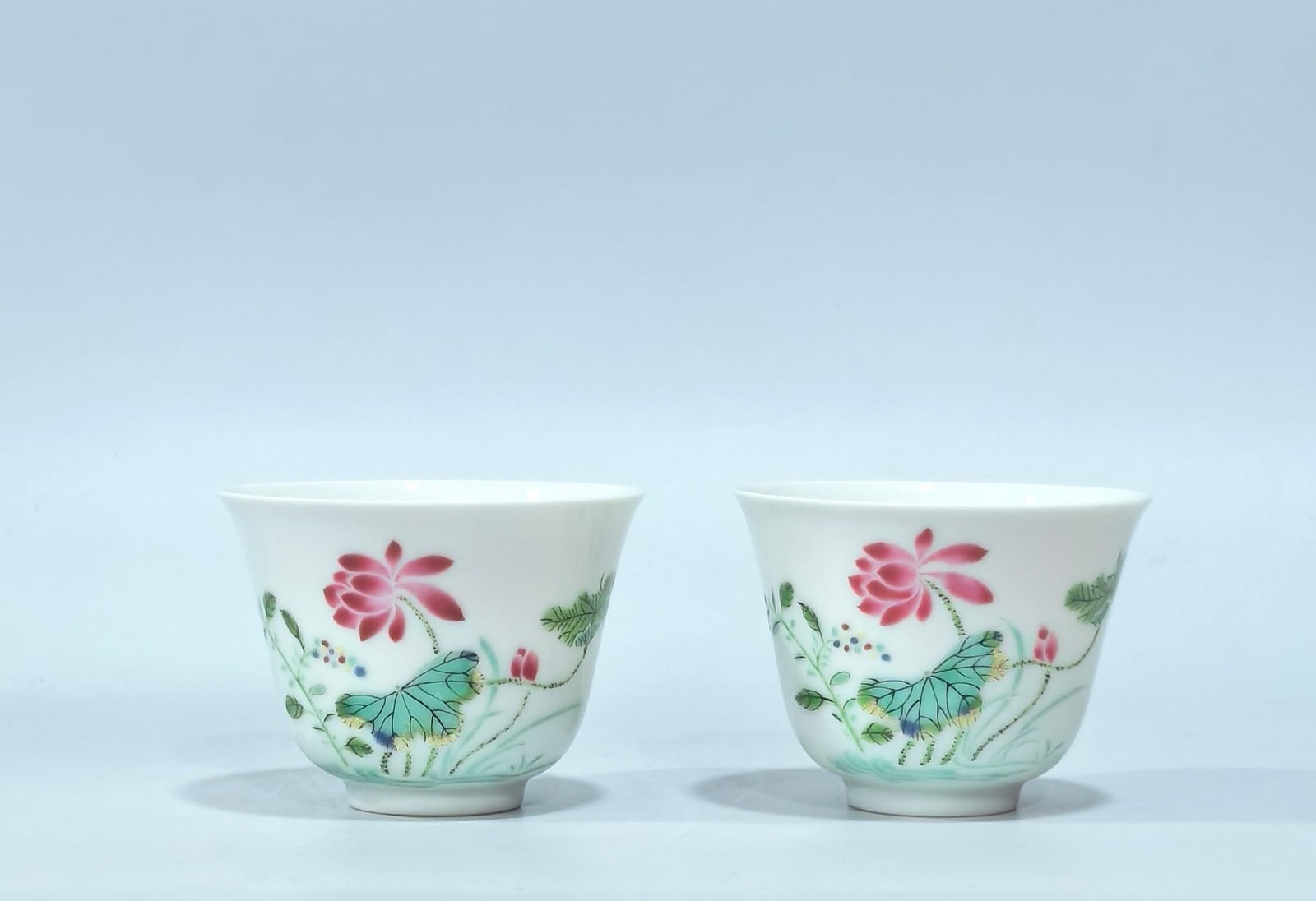 A Pair of Exquisite Famille-Rose Lotus Pattern Cups: A Pair of Exquisite Famille-Rose Lotus Pattern Cups,Qing Dynasty,China,Yongzheng Four-character Mark,Size:2inx2.7in 一对粉彩荷花纹杯子,中