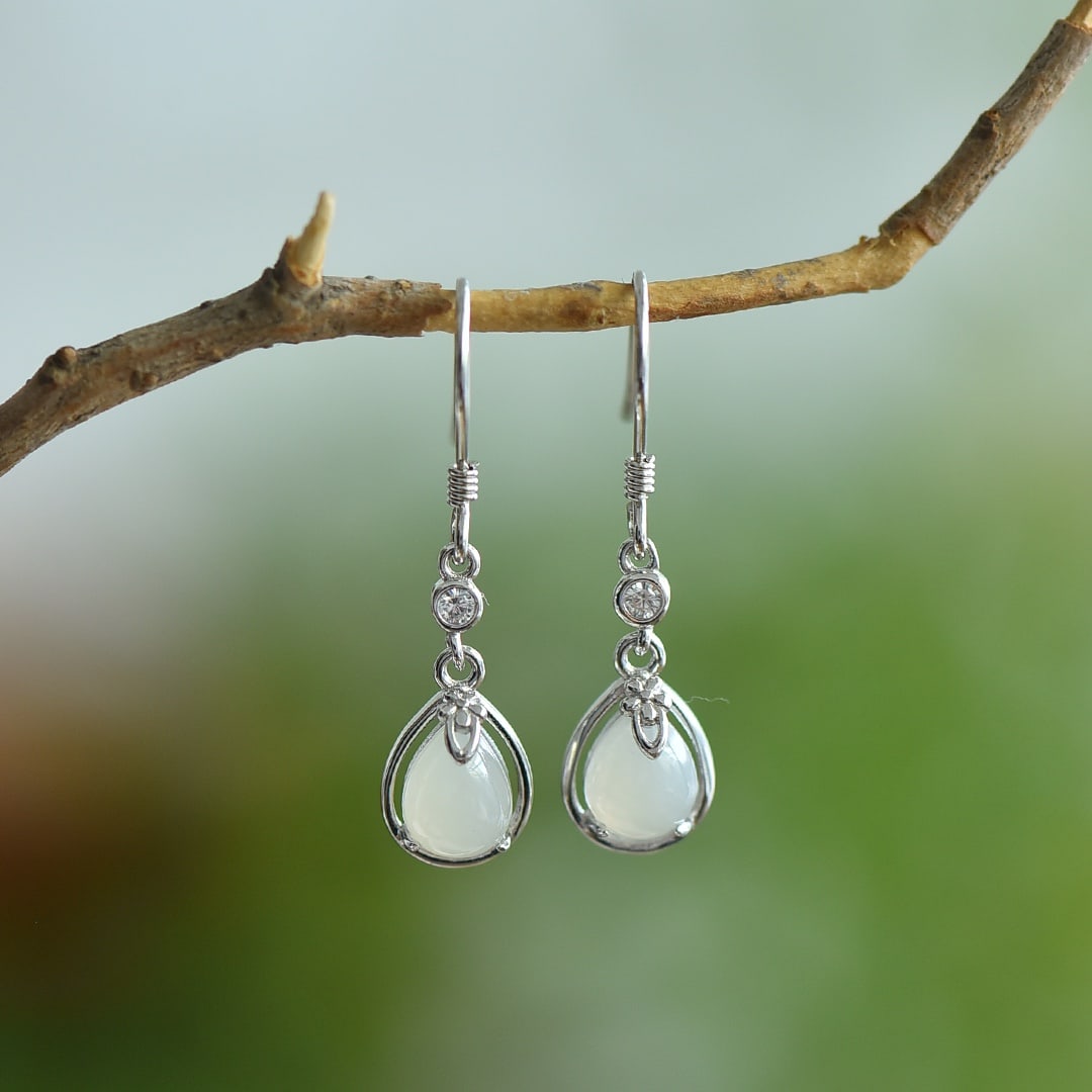 A Pair of Exquisite Sterling Silver Inlaid White Jade Earrings: A Pair of Exquisite Sterling Silver Inlaid White Jade Earrings,Size:0.2inx0.3in 一对纯银镶白玉耳环