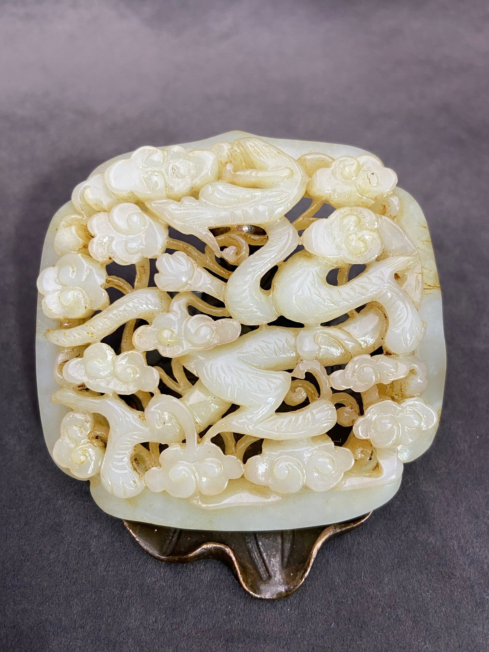 An Exquisite White Jade Hollow Auspicious Cloud and Dragon Pattern Pendant: An Exquisite White Jade Hollow Auspicious Cloud and Dragon Pattern Pendant,Qing Dynasty,China,Size:77.2mmx77.8mmx12mm,Weight:76g 白玉镂空祥云龙纹挂