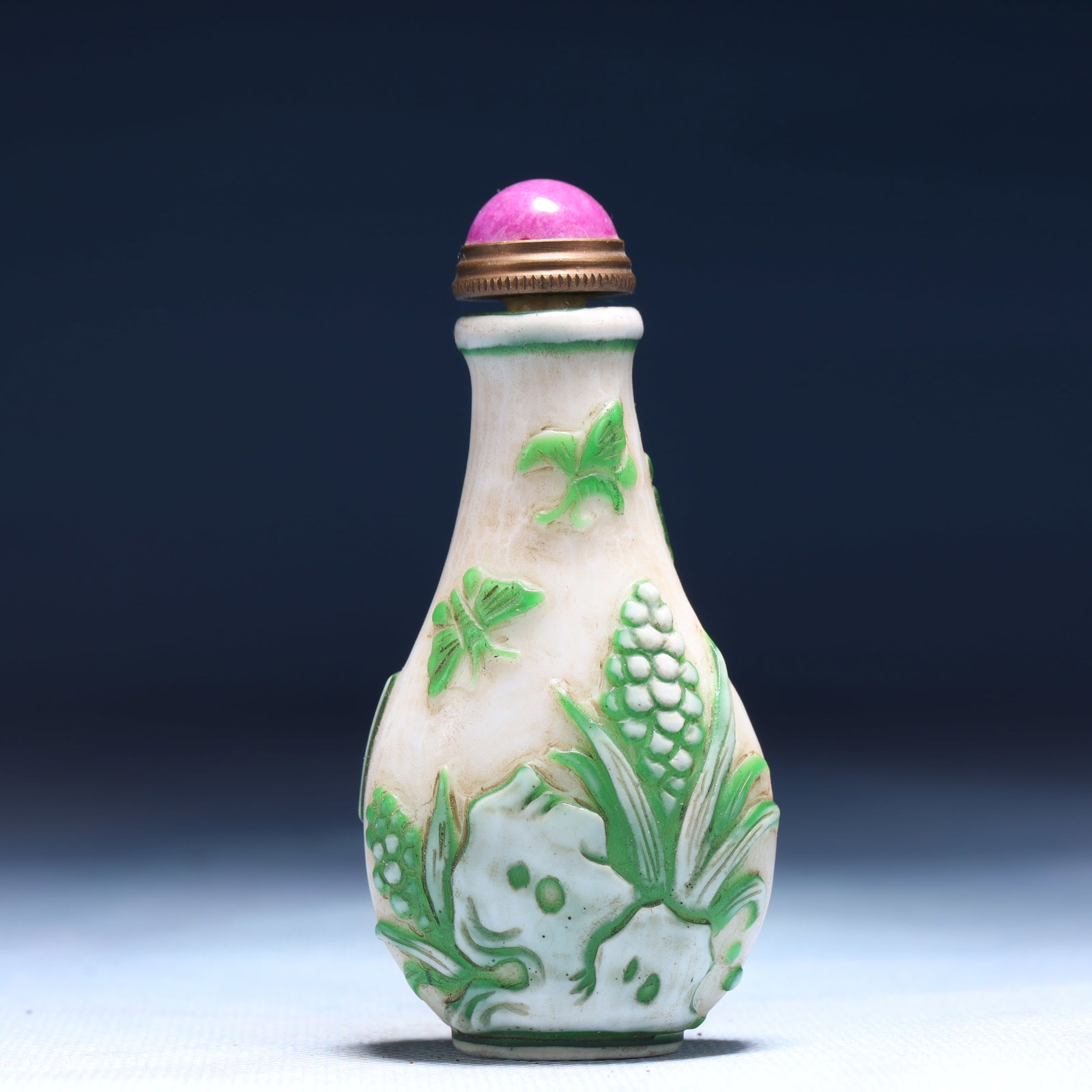 An Exquisite Glass Flower and Butterfly Pattern Snuff Bottle: An Exquisite Glass Flower and Butterfly Pattern Snuff Bottle,Qing Dynasty,China,Qianlong Four-character Mark,Size:1.6inx0.8inx3.1in,Weight:46g 琉璃花卉蝴蝶纹&
