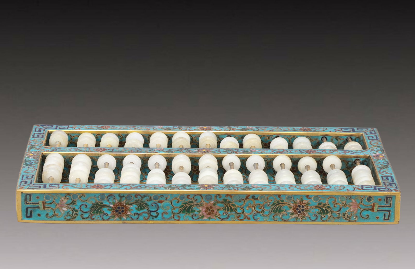 A Rare Cloisonne Lotus Pattern Abacus,Inlaid White Jade: A Rare Cloisonne Lotus Pattern Abacus,Inlaid White Jade,Qing Dynasty,China,Size:14.8inx6.9inx1.4in,Weight:3000g 景泰蓝缠枝莲纹算盘,嵌白