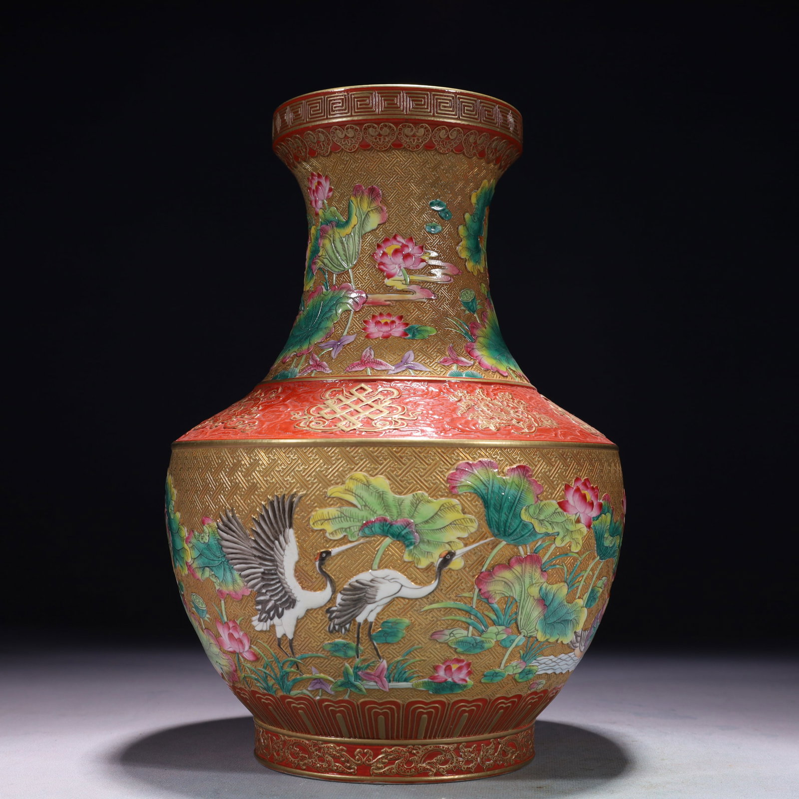 An Exquisite Gold Ground Famille-Rose Flower and Crane Pattern Vase: An Exquisite Gold Ground Famille-Rose Flower and Crane Pattern Vase,Qing Dynasty,China,Qianlong Six-character Mark,Size:7.5inx11.8in,Weight:3050g 金地粉彩花卉࿖