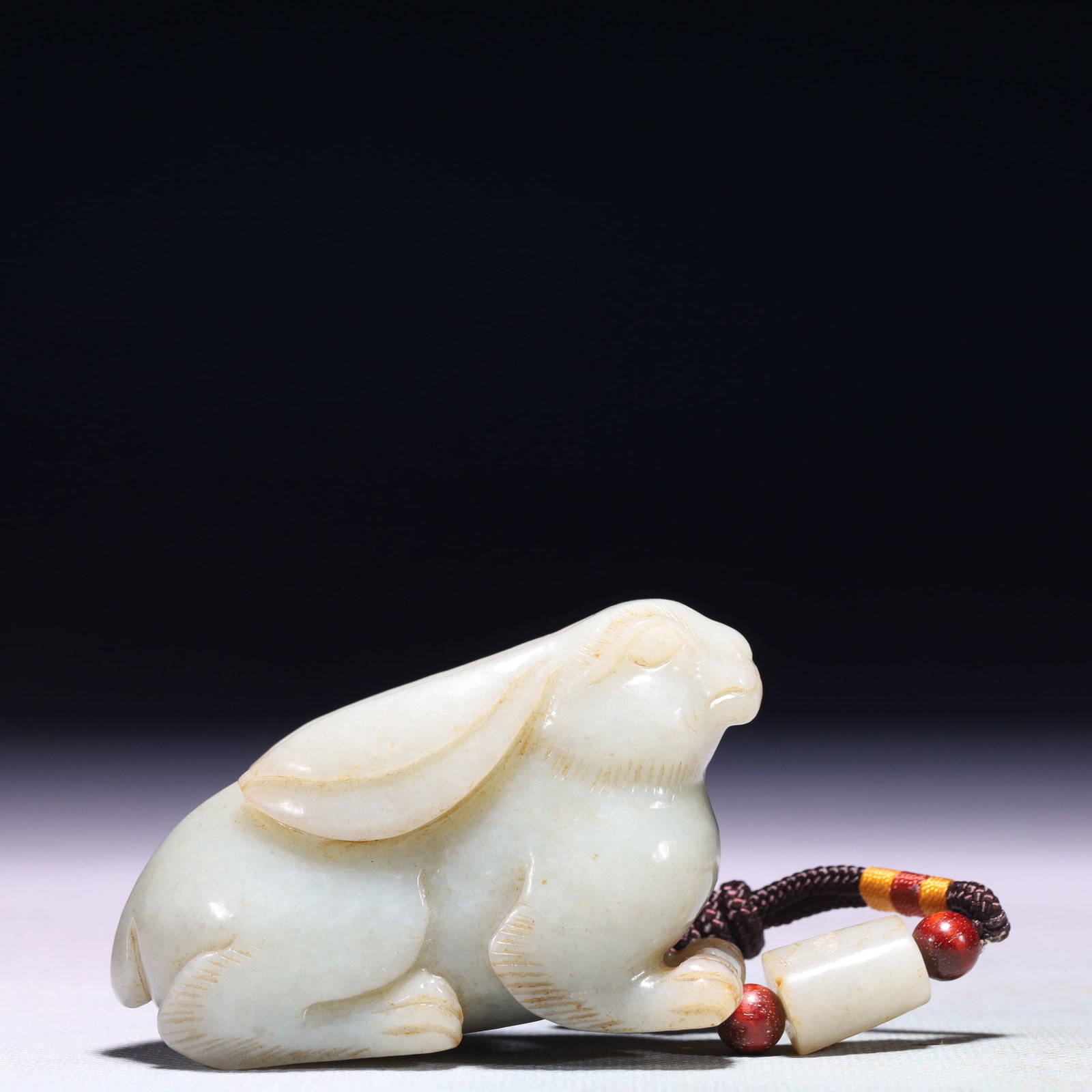 An Exquisite White Jade Rabbit Ornament: An Exquisite White Jade Rabbit Ornament,Qing Dynasty,China,Size:2.8inx1.2inx1.8in,Weight:199.8g 白玉兔子摆件,中国清代