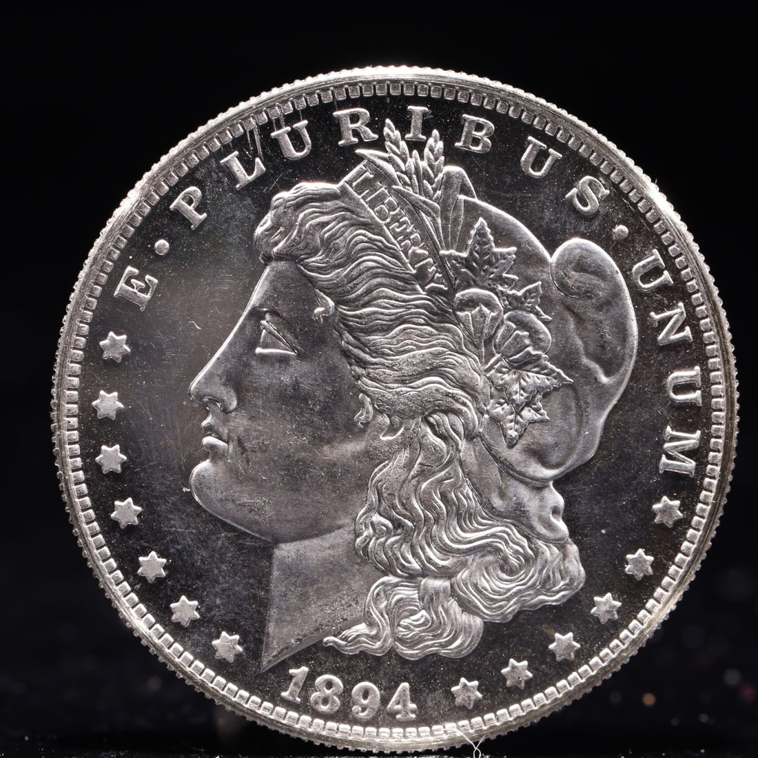 USA Morgan Dollar 1894 Coin: Obv: profile bust with date below and E PLURIBUS UNUM legend and stars around. Rev: eagle with In God we trust above within wreath with UNITED STATES OF AMERICA ONE DOLLAR legend. IN GOD WE TRUST / LI