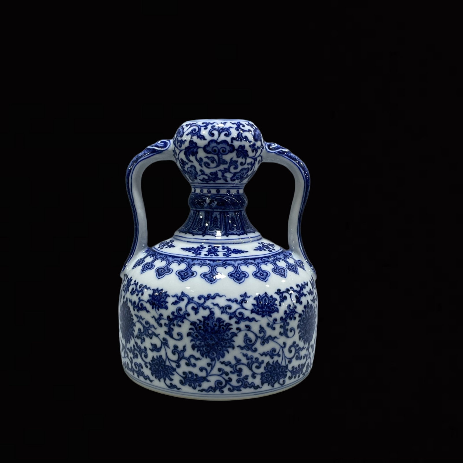 An Exquisite Blue and White Lotus Pattern Double-Ears Vase: An Exquisite Blue and White Lotus Pattern Double-Ears Vase,Qing Dynasty,China,Qianlong Six-character Mark,Size:8.1inx6.3in 青花缠枝莲纹双耳瓶,