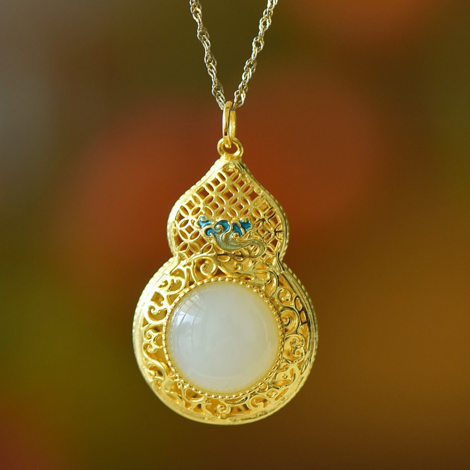 An Exquisite Sterling Silver-Gold Plated Inlaid White Jade Pendant: An Exquisite Sterling Silver-Gold Plated Inlaid White Jade Pendant 纯银镀金镶白玉吊坠