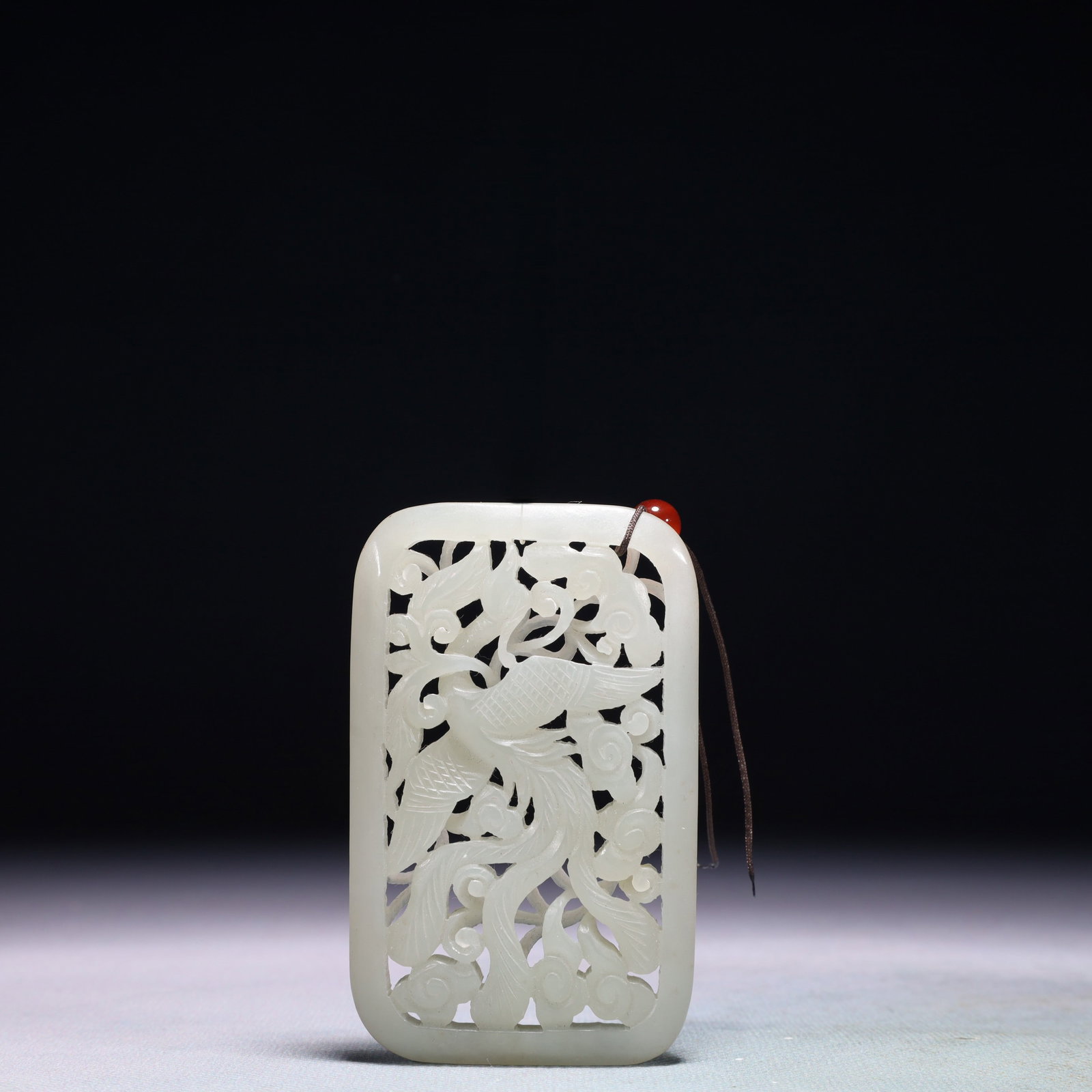An Exquisite White Jade Flower and Phoenix Pattern Pendant: An Exquisite White Jade Flower and Phoenix Pattern Pendant,Qing Dynasty,China,Size:2inx3.3in,Weight:71.7g 白玉花卉凤纹佩,中国清代