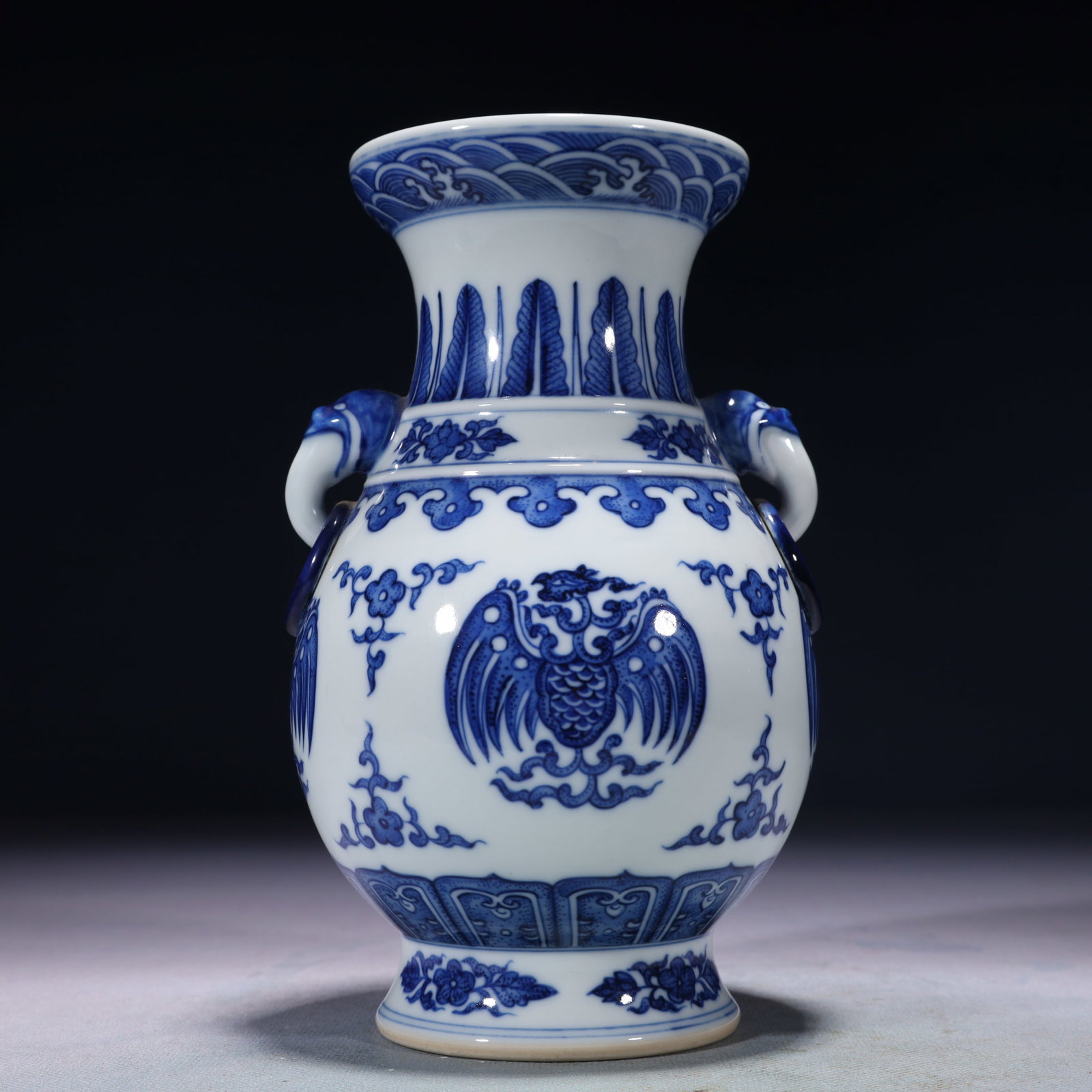 An Exquisite Blue and White Lotus and Phoenix Pattern Double-Ears Vase: An Exquisite Blue and White Lotus and Phoenix Pattern Double-Ears Vase,Qing Dynasty,China,Qianlong Six-character Mark,Size:4.7inx7.5in,Weight:850g 青花缠枝莲凤ń