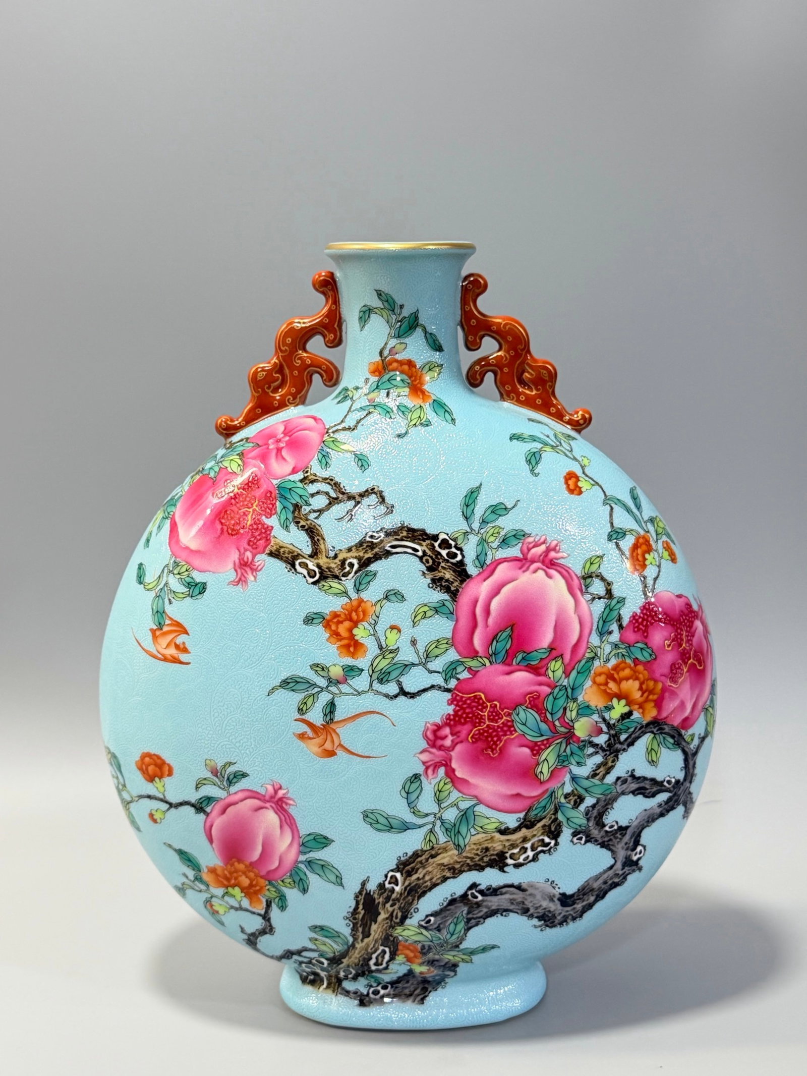 A Rare Turquoise Glazed Famille-Rose Flower and Fruit Pattern Double-Ears Vase: A Rare Turquoise Glazed Famille-Rose Flower and Fruit Pattern Double-Ears Vase,Qing Dynasty,China,Qianlong Six-character Mark,Size:12.4inx10in 松石绿釉粉彩花&