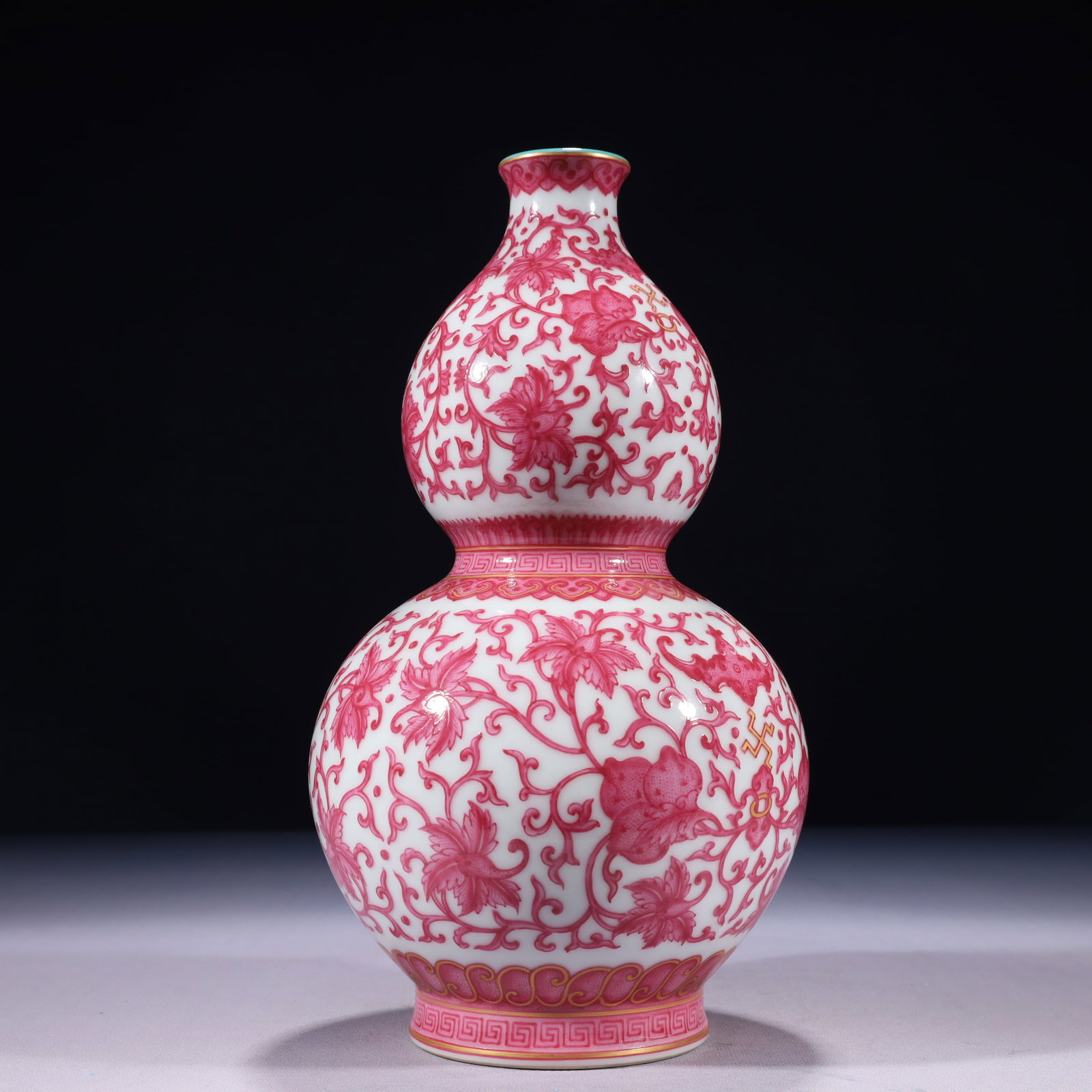 An Exquisite Ruby Red-Glazed Painted Gold Lotus Pattern Gourd-Shaped Vase: An Exquisite Ruby Red-Glazed Painted Gold Lotus Pattern Gourd-Shaped Vase,Qing Dynasty,China,Qianlong Six-character Mark,Size:5.5inx11in,Weight:1400g 胭脂红描金缠&#