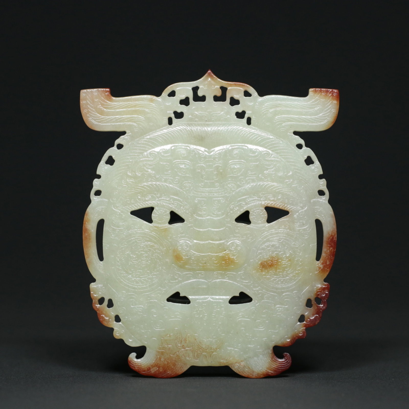 An Exquisite White Jade Figure-Face Pattern Pendant: An Exquisite White Jade Figure-Face Pattern Pendant,Han Dynasty,China,Size:4.3inx3.6inx0.2in,Weight:104.3g 白玉人面纹挂件,中国汉代
