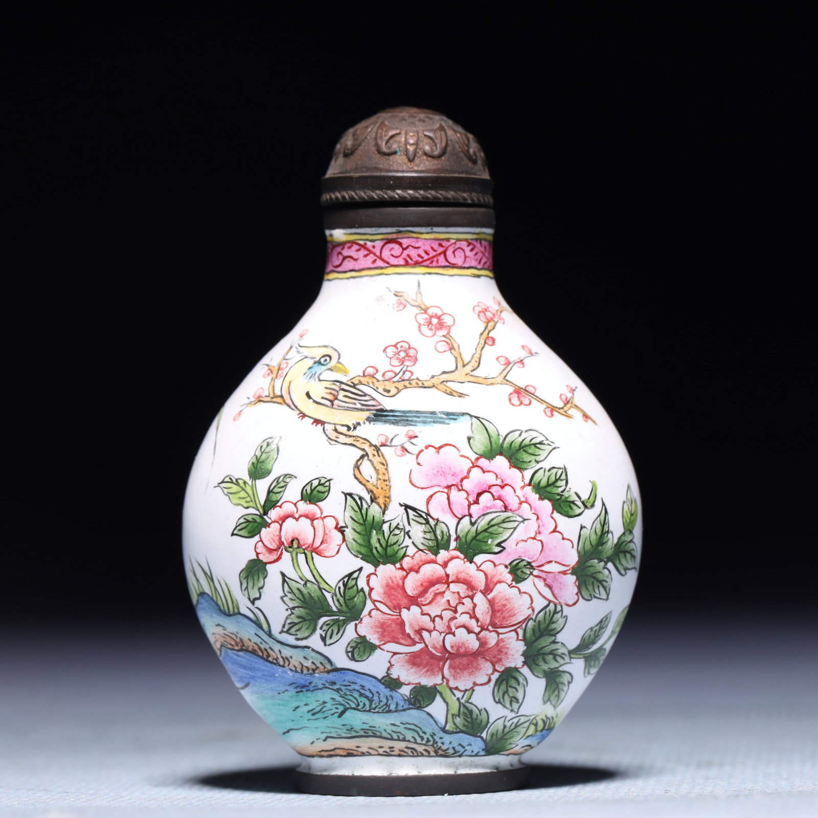 An Exquisite Painted Enamel Flower and Bird Pattern Snuff Bottle: An Exquisite Painted Enamel Flower and Bird Pattern Snuff Bottle,Qing Dynasty,China,Qianlong Four-character Mark,Size:1.6inx1inx2.4in,Weight:53.8g