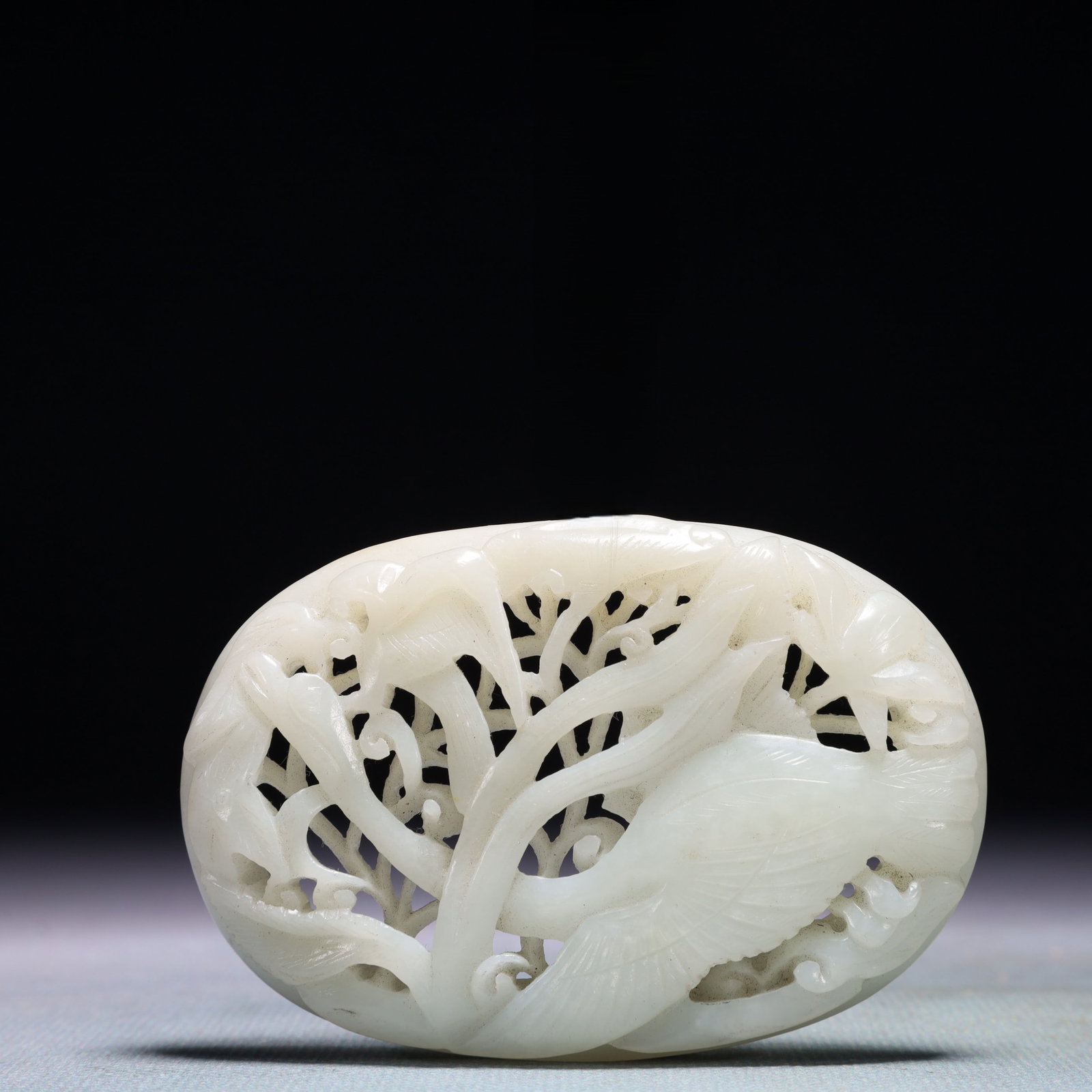 An Exquisite White Jade Flower and Bird Pattern Pendant: An Exquisite White Jade Flower and Bird Pattern Pendant,Qing Dynasty,China,Size:3.1inx2in,Weight:63.4g 白玉花鸟纹佩,中国清代