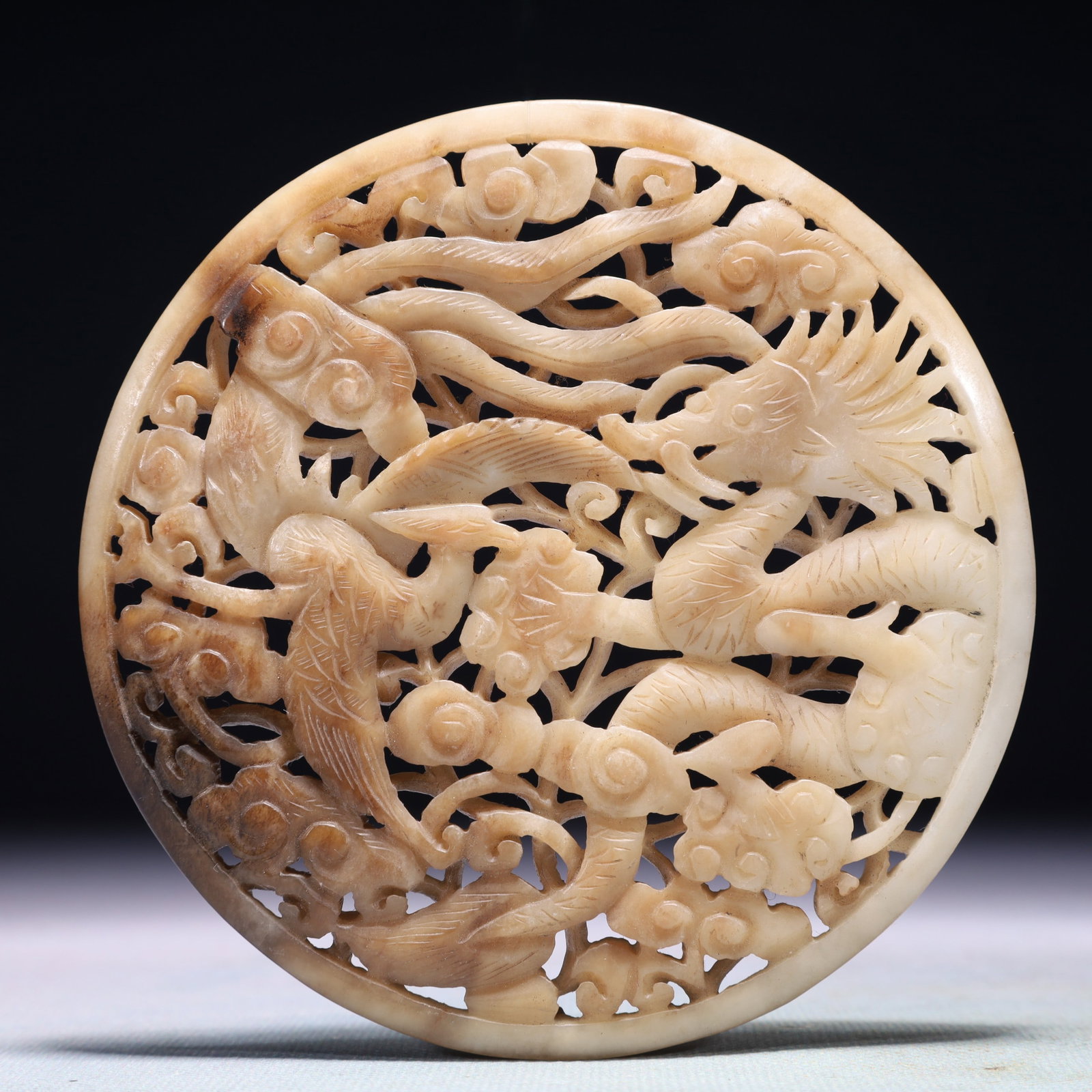 An Exquisite White Jade Auspicious Cloud and Dragon Pattern Pendant: An Exquisite White Jade Auspicious Cloud and Dragon Pattern Pendant,Qing Dynasty,China,Size:4.5inx4.5in,Weight:144.2g 白玉祥云龙纹佩,中国清&