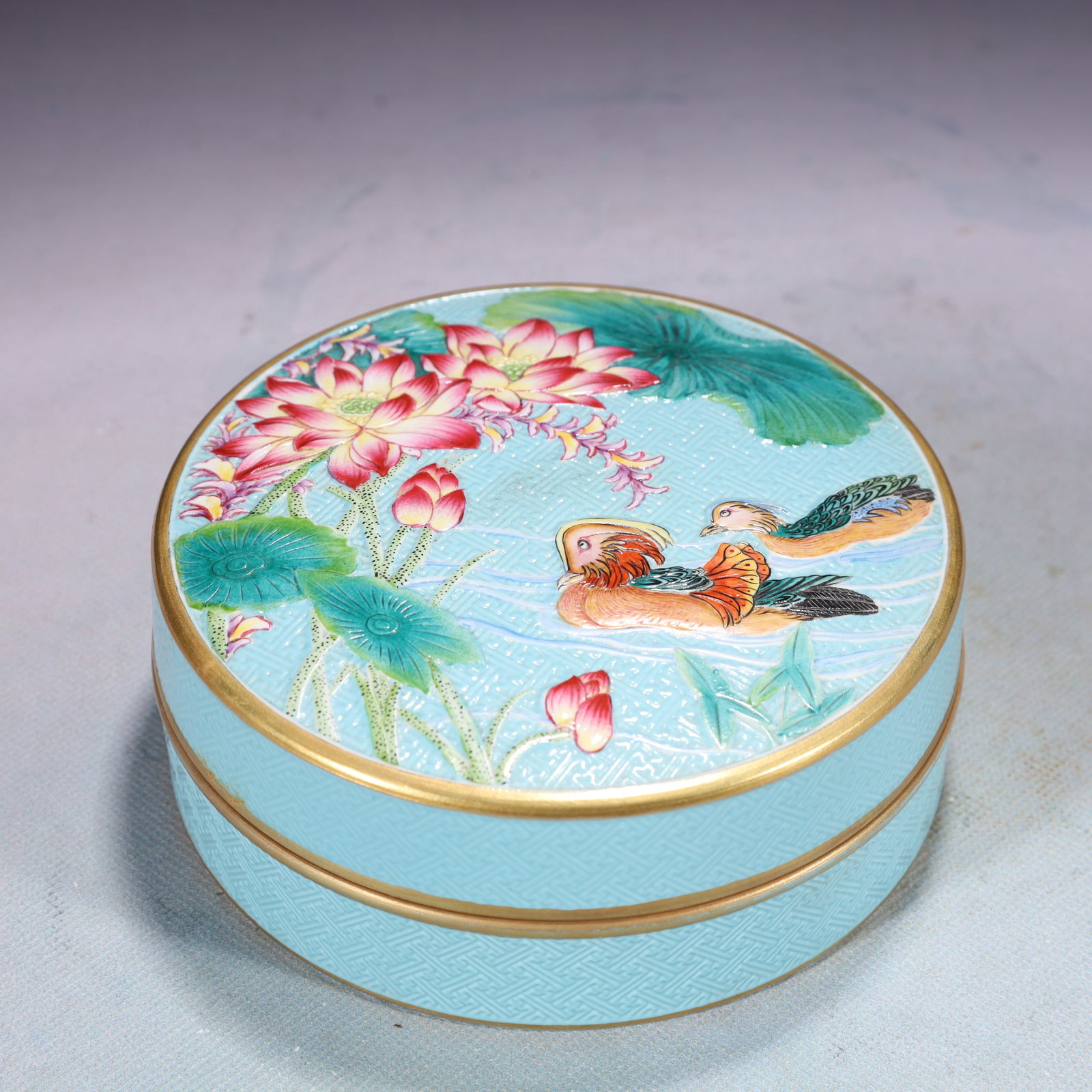 An Exquisite Turquoise Glazed Famille-Rose Painted Gold Flower and Mandarin Duck Pattern Box with: An Exquisite Turquoise Glazed Famille-Rose Painted Gold Flower and Mandarin Duck Pattern Box with Cover,Qing Dynasty,China,Qianlong Four-character Mark,Size:5.3inx2in,Weight:750g 松石Ņ
