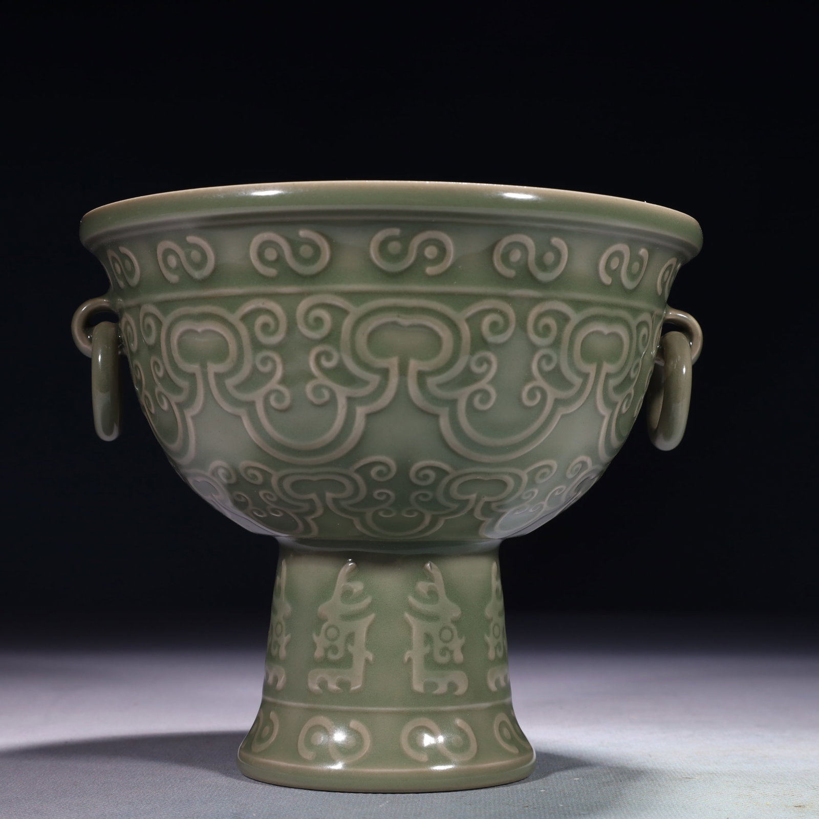 An Exquisite Celadon Glazed Auspicious Cloud Pattern Double-Ears Stem Bowl: An Exquisite Celadon Glazed Auspicious Cloud Pattern Double-Ears Stem Bowl,Song Dynasty,China,Size:6.3inx5.5in,Weight:700g 青釉祥云纹双耳高足Ĵ