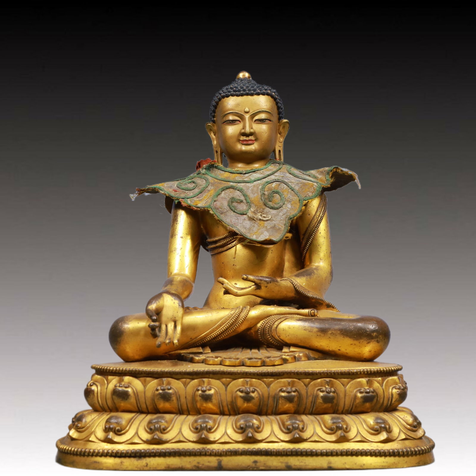 A Solemn Gilt Bronze Statue of Sakyamuni: A Solemn Gilt Bronze Statue of Sakyamuni, Ming Dynasty, China, Size:15.4inx11.4inx17.7in, Weight:16700g 铜鎏金如来像,中国明代,尺ल